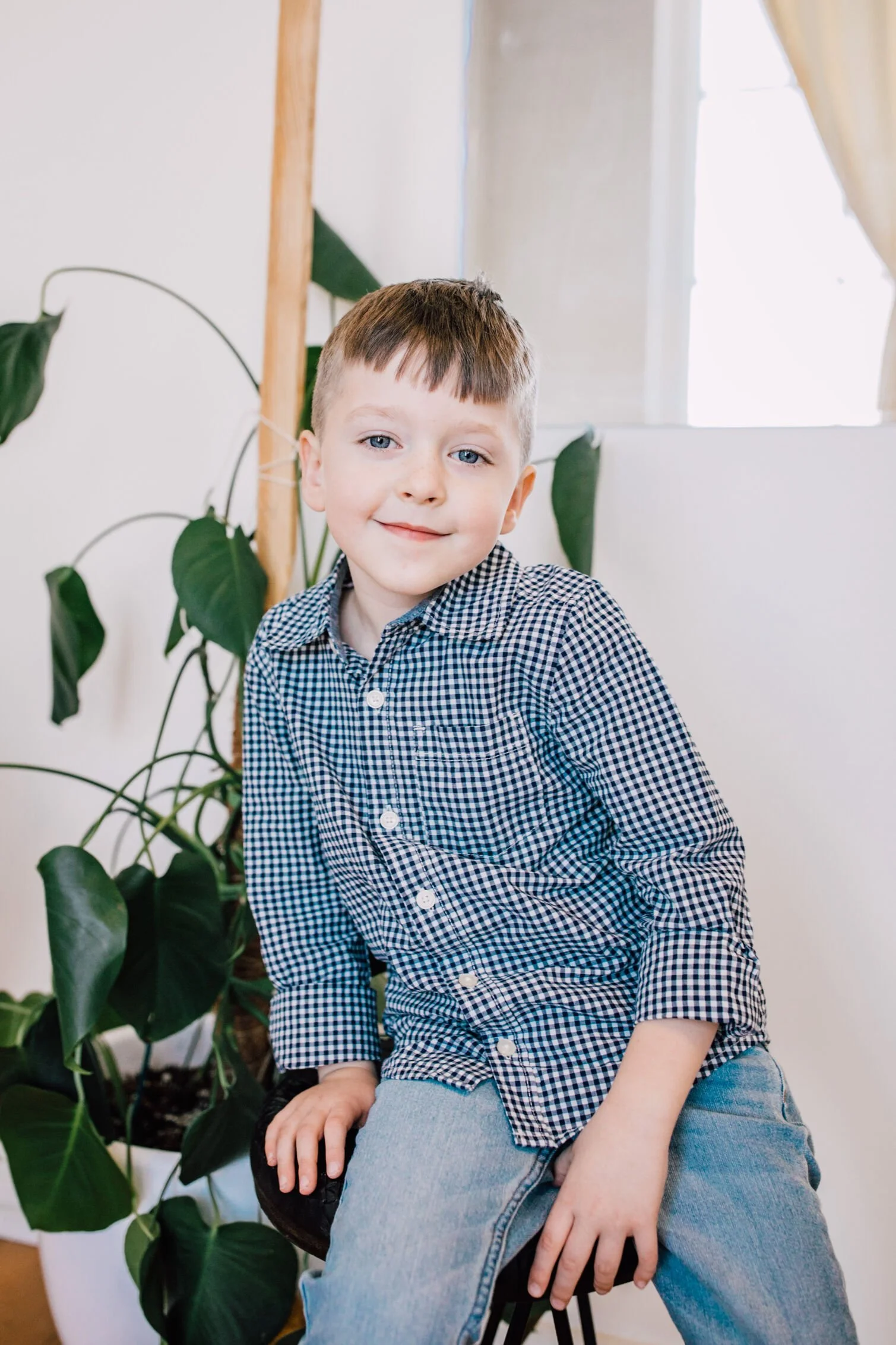 Young boy smiles during family mini sessions
