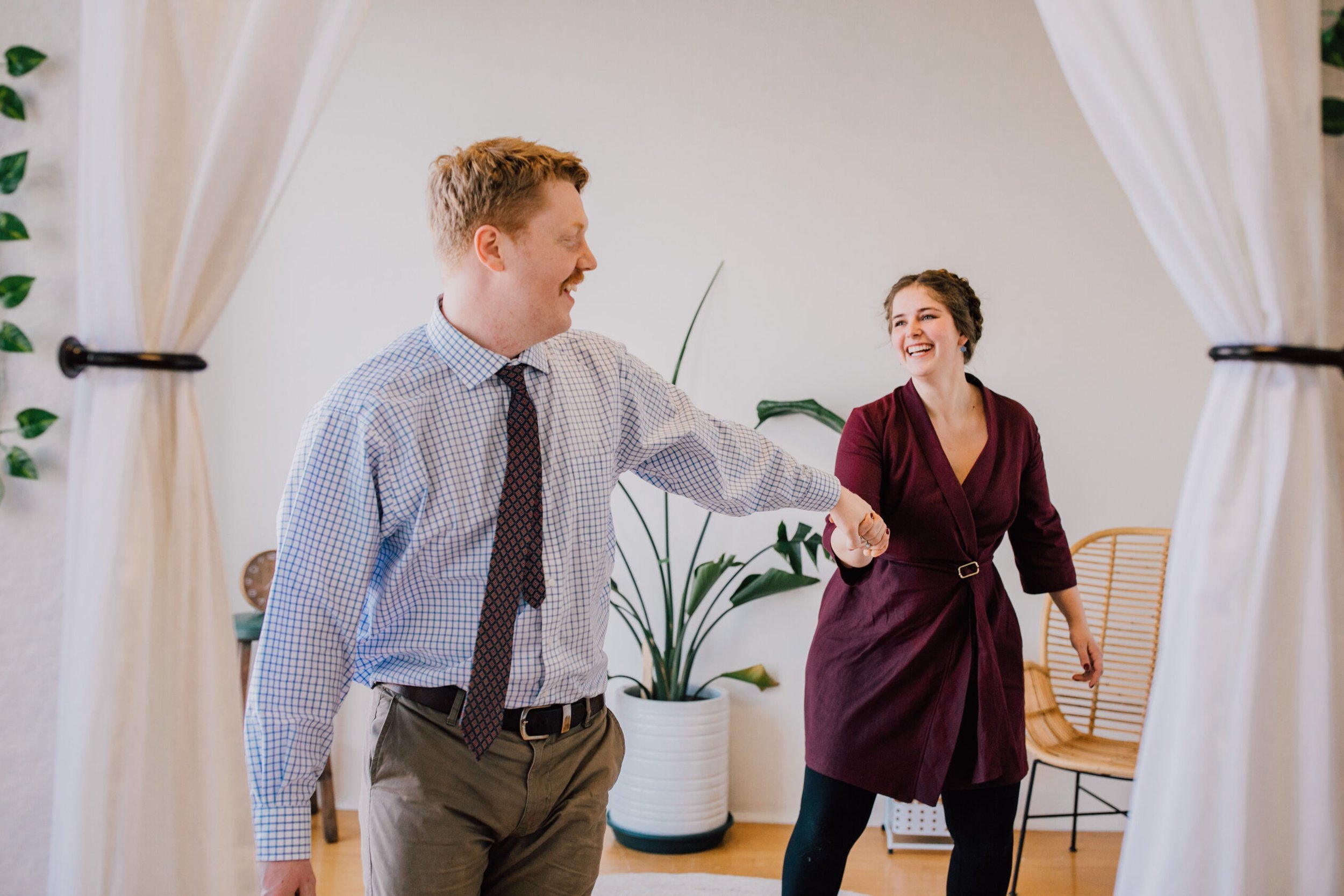  Couple holds hands during couples session 