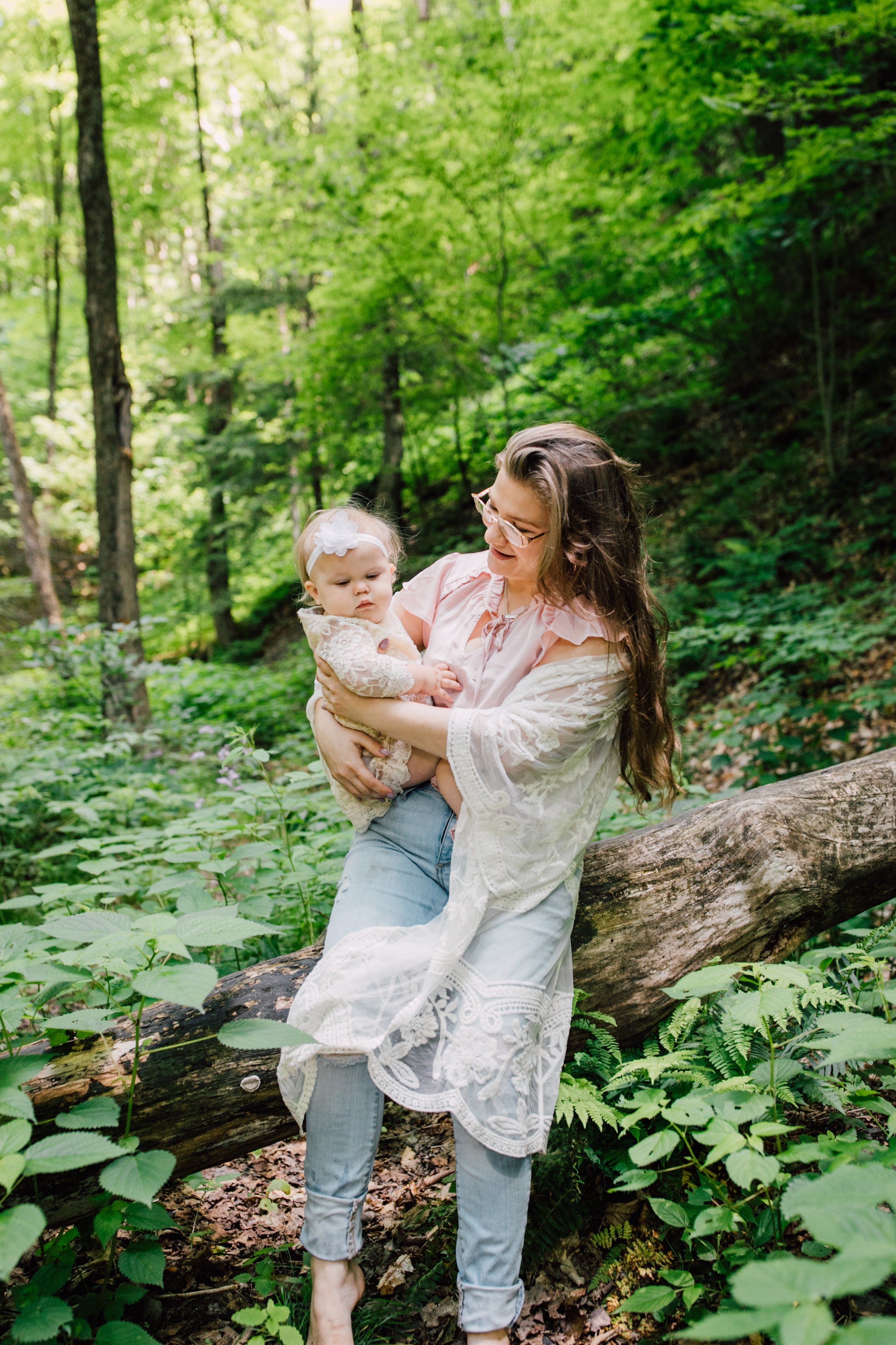  Mama holds her girl during a family adventure session in Ithaca New York 