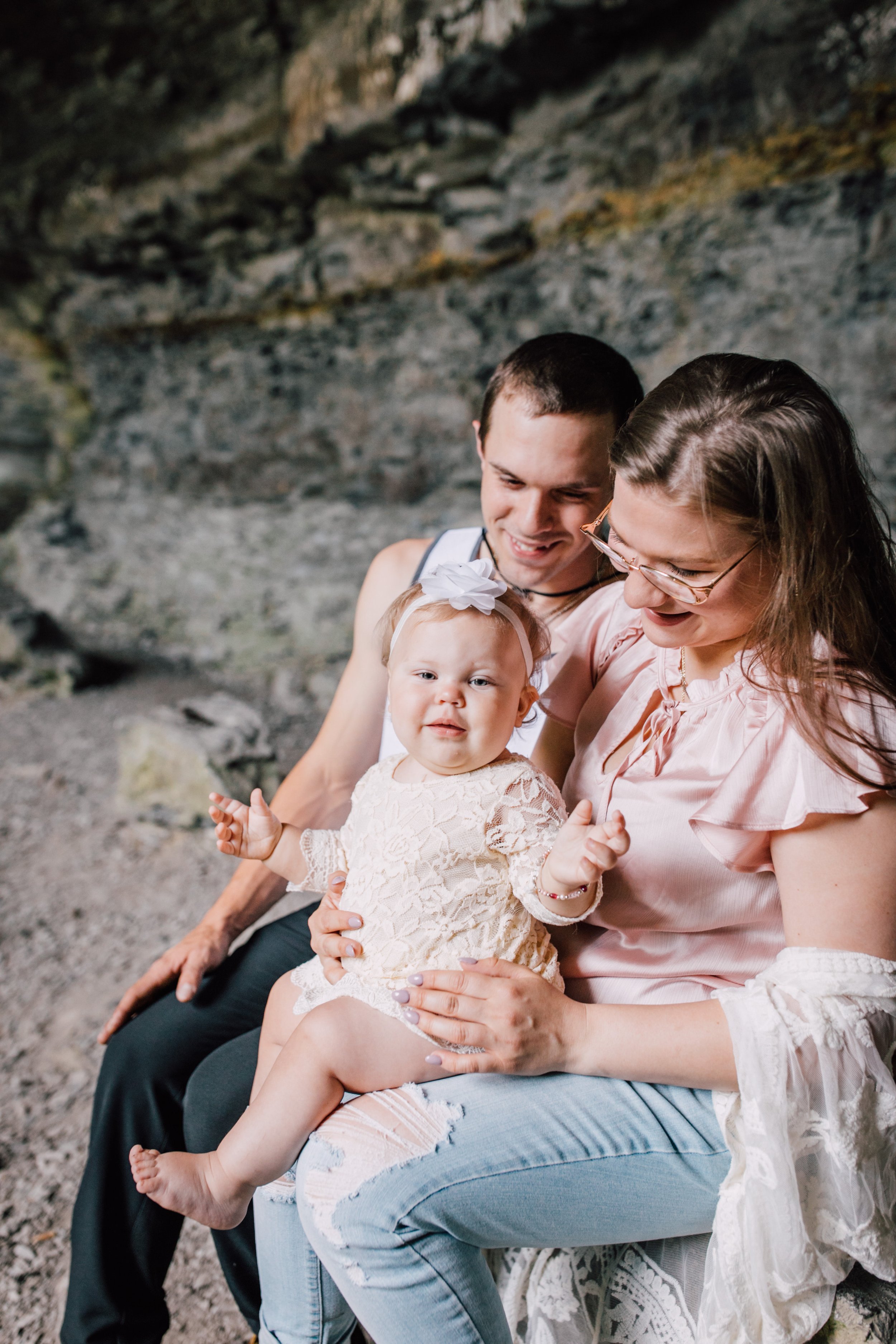  Family sits together during their waterfall photo shoot 