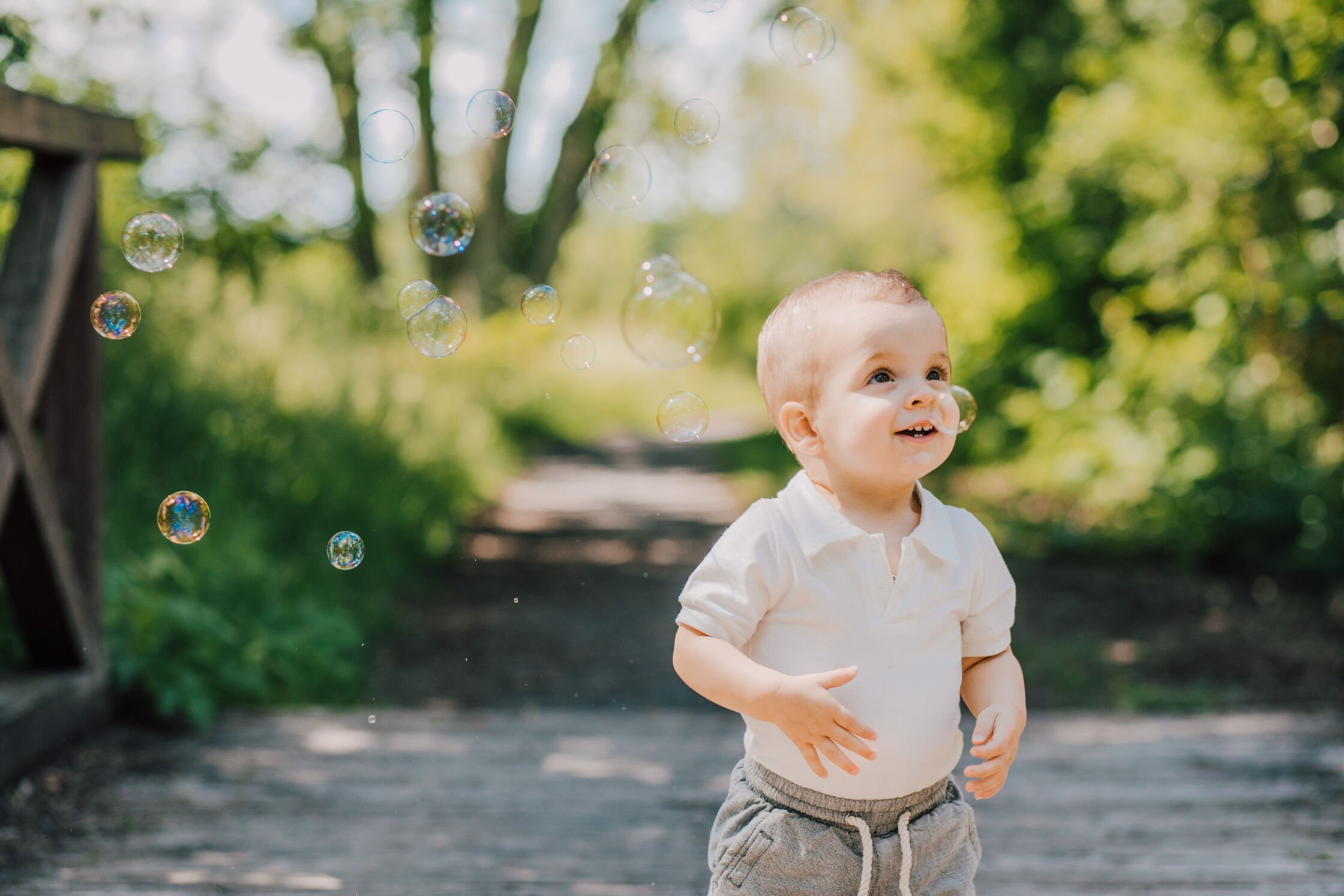  Toddler stands in awe of bubbles at Onondaga Lake Parkway 