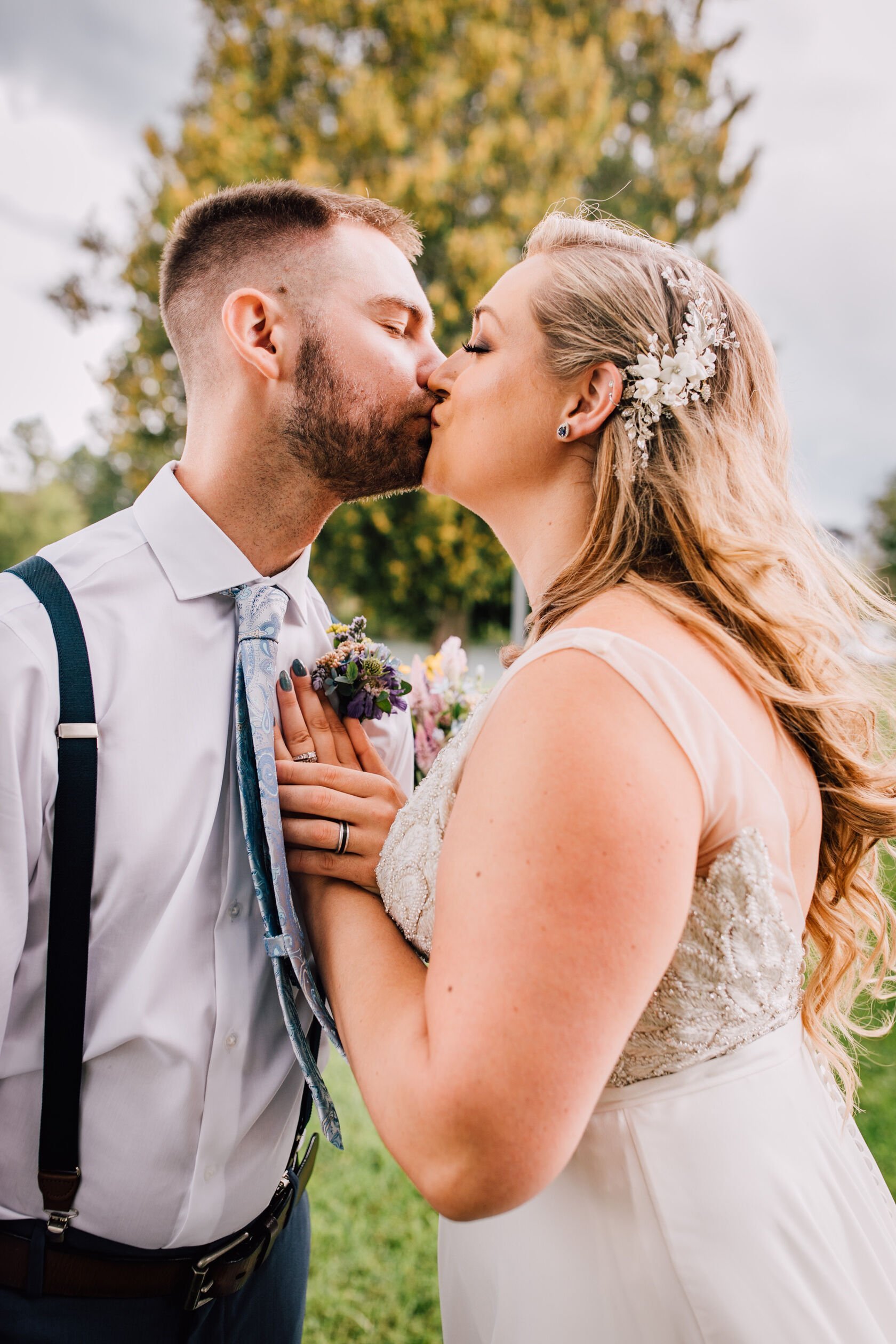  Bride and groom share a kiss during portraits at 3 rivers park 