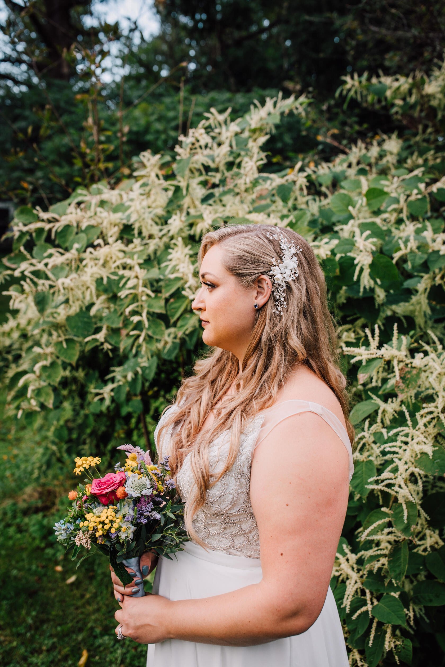  Bride’s side profile and bridal hair from a backyard wedding reception 