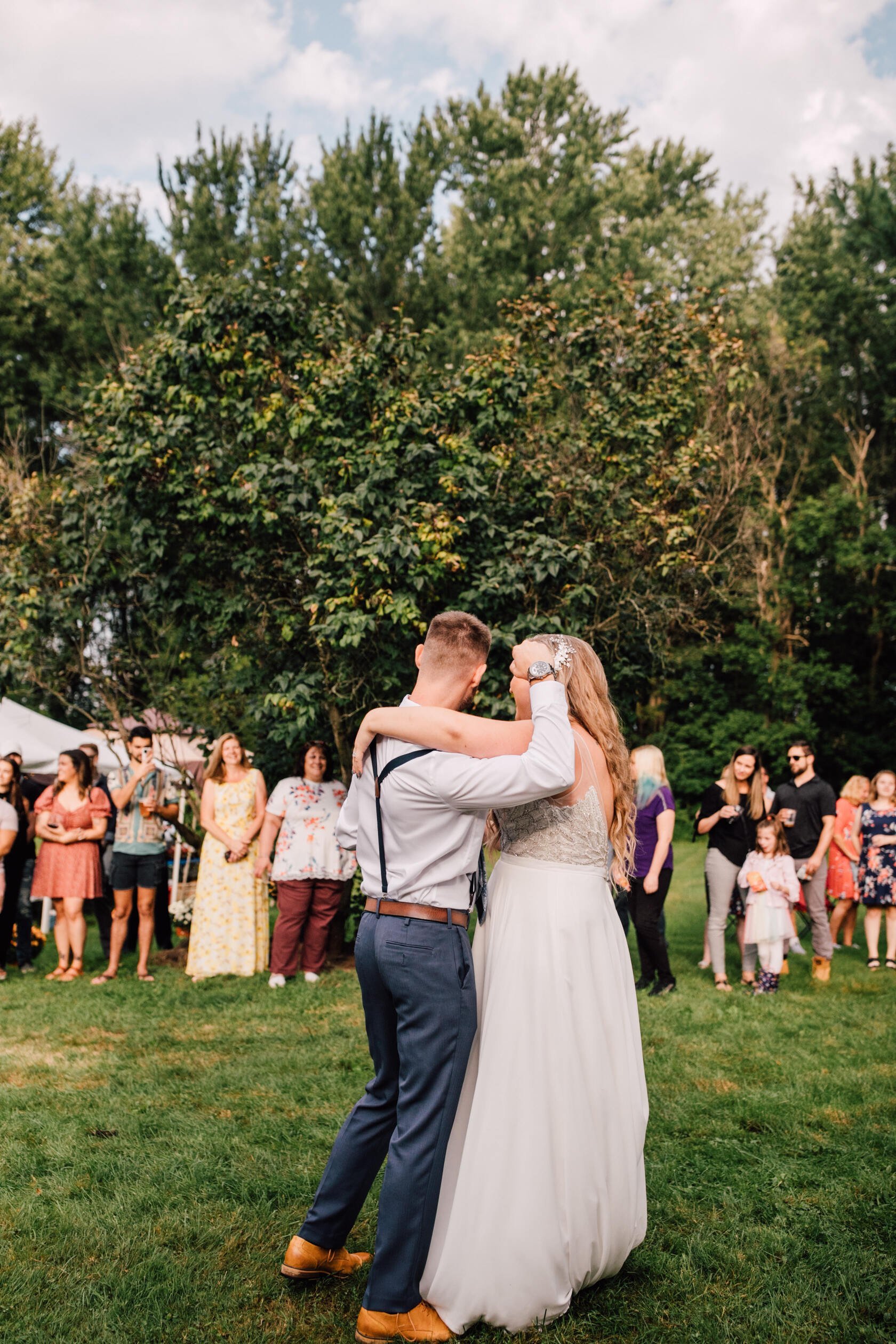  Groom celebrates his first dance with his wife at their backyard wedding 