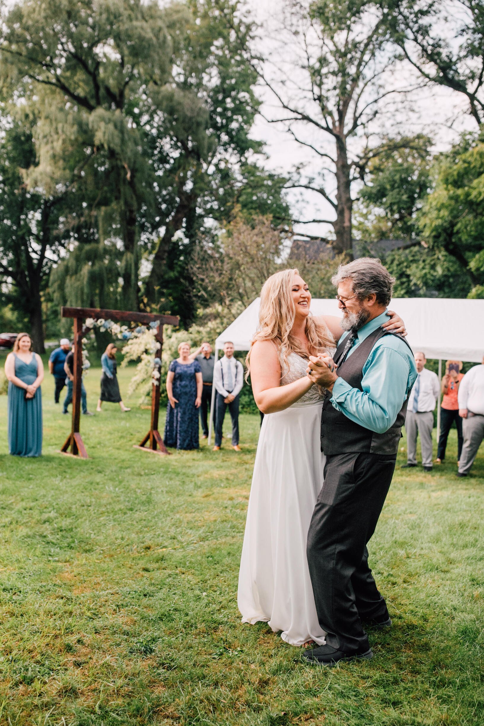  Father daughter dance at a backyard wedding reception 