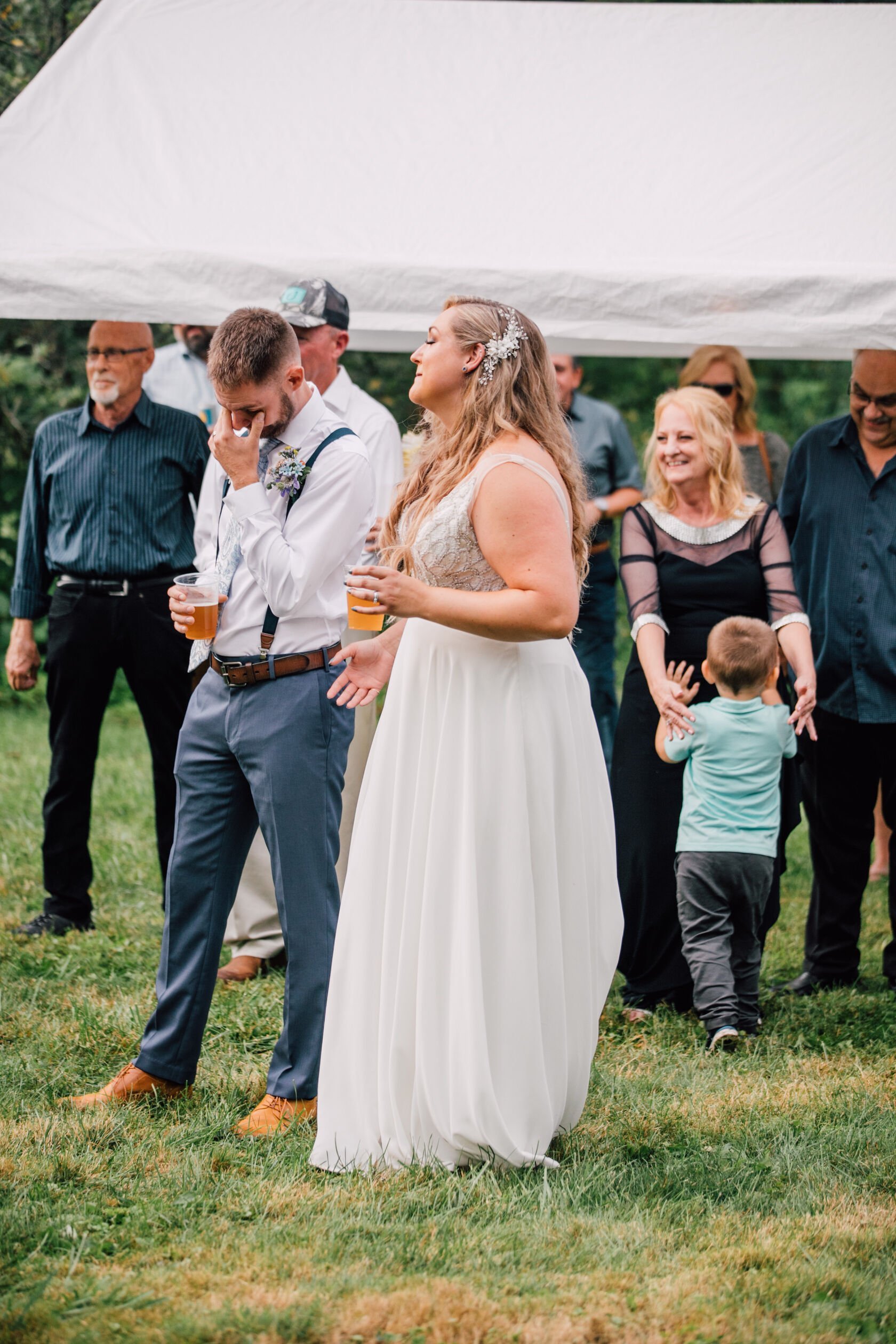  Groom tears up during toasts at a backyard wedding reception 