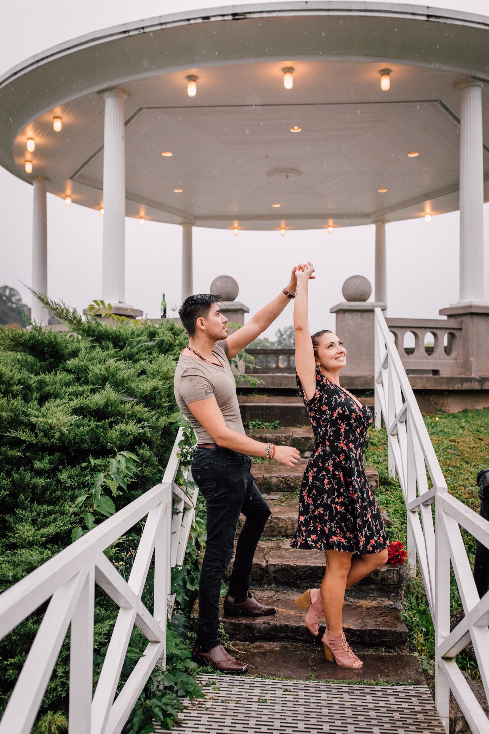  pablo spins jessica as they dance in front of a gazebo at upper onondaga park  