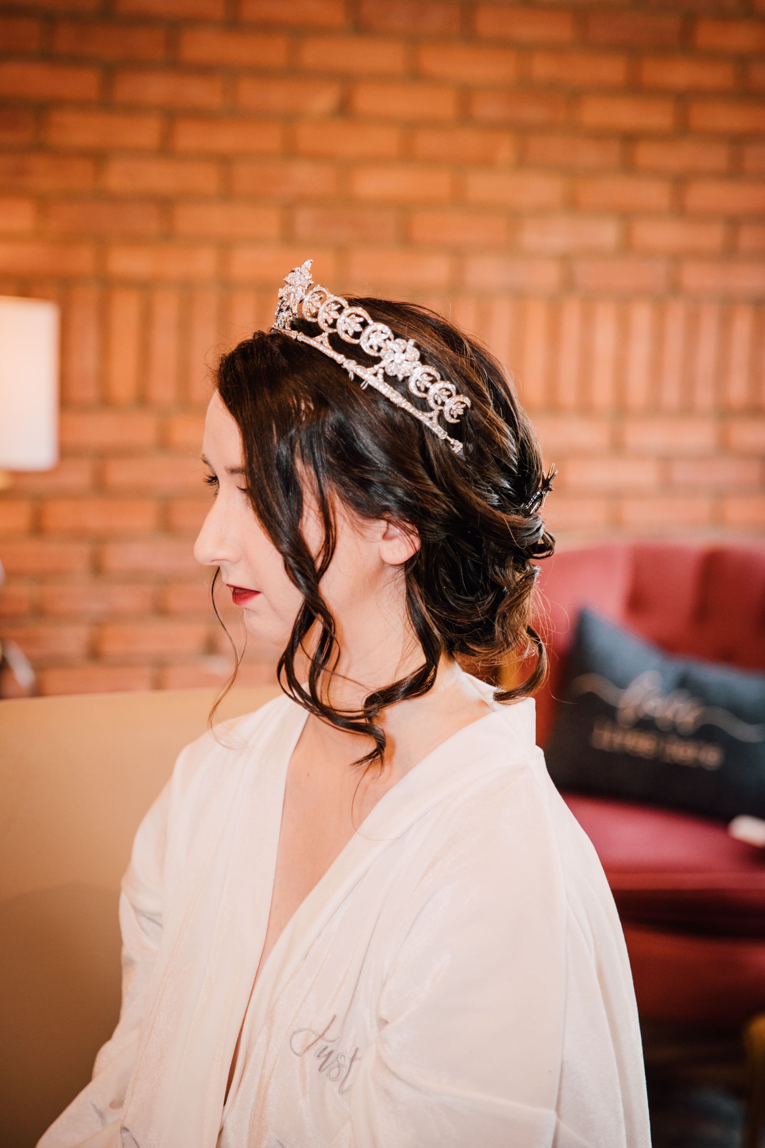 a side profile of the bride getting ready before her lake ontario wedding 