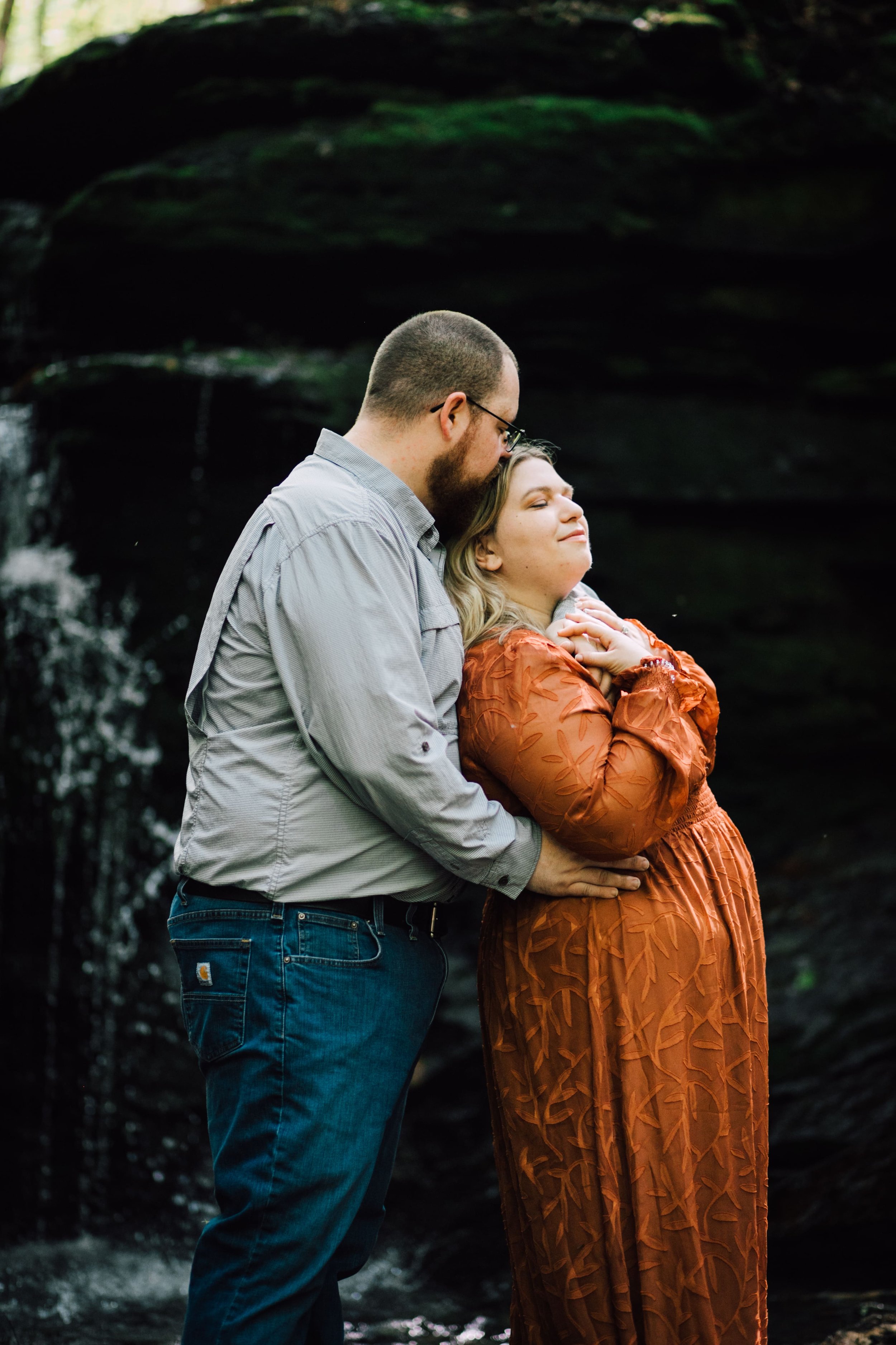  patrick kisses his fiancee, brittany on the top of her head during their engagement session at labrador hollow 