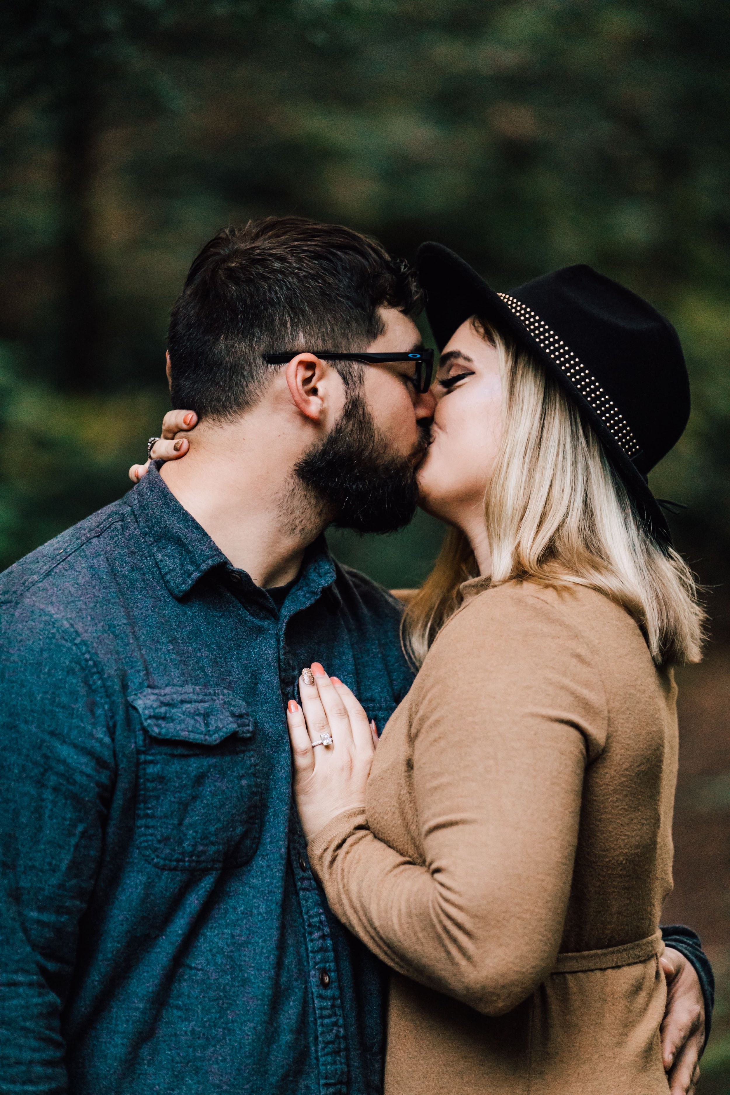  engaged couple kiss during proposal photos 