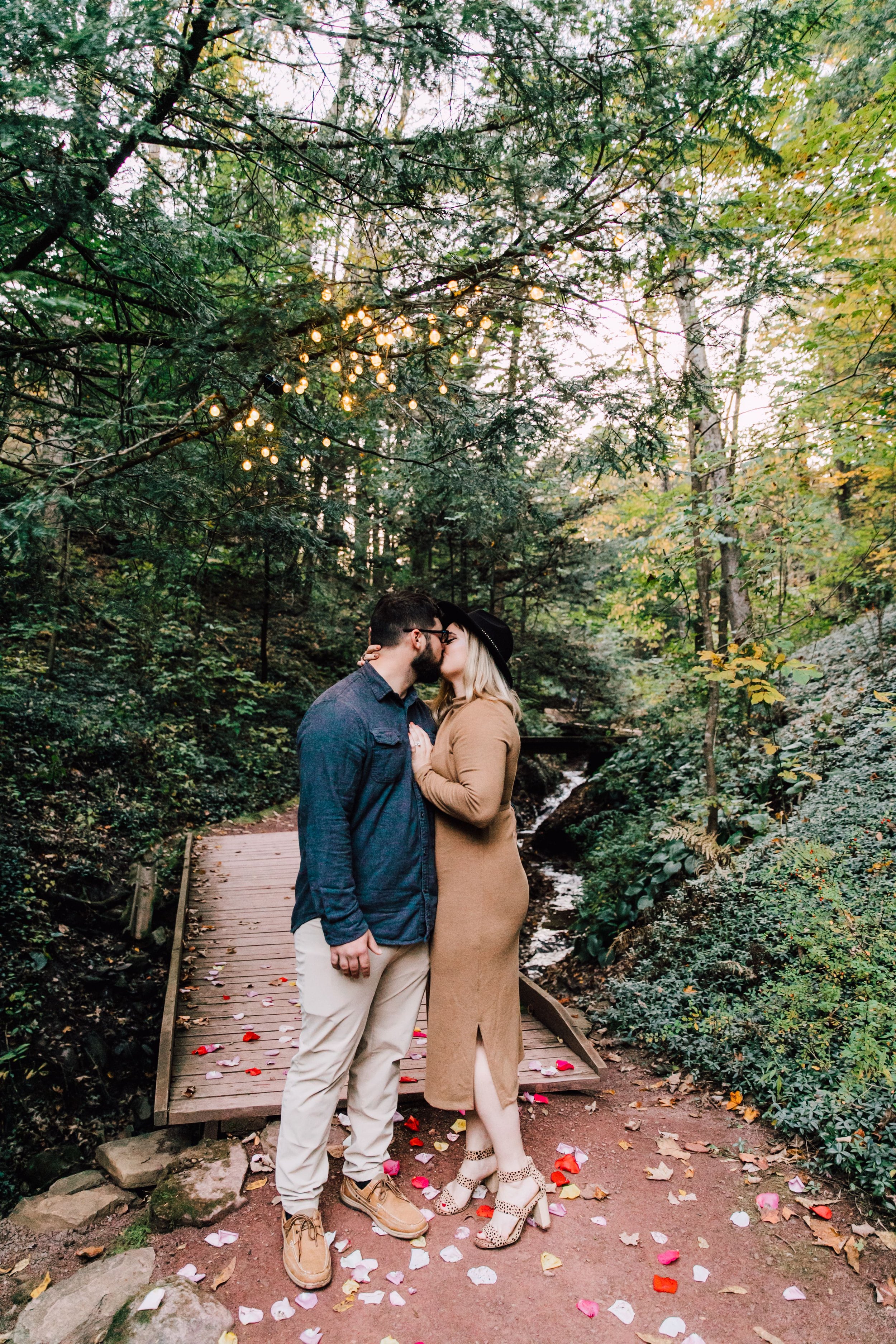  engaged couple kiss for proposal photos after dustin popped the question 