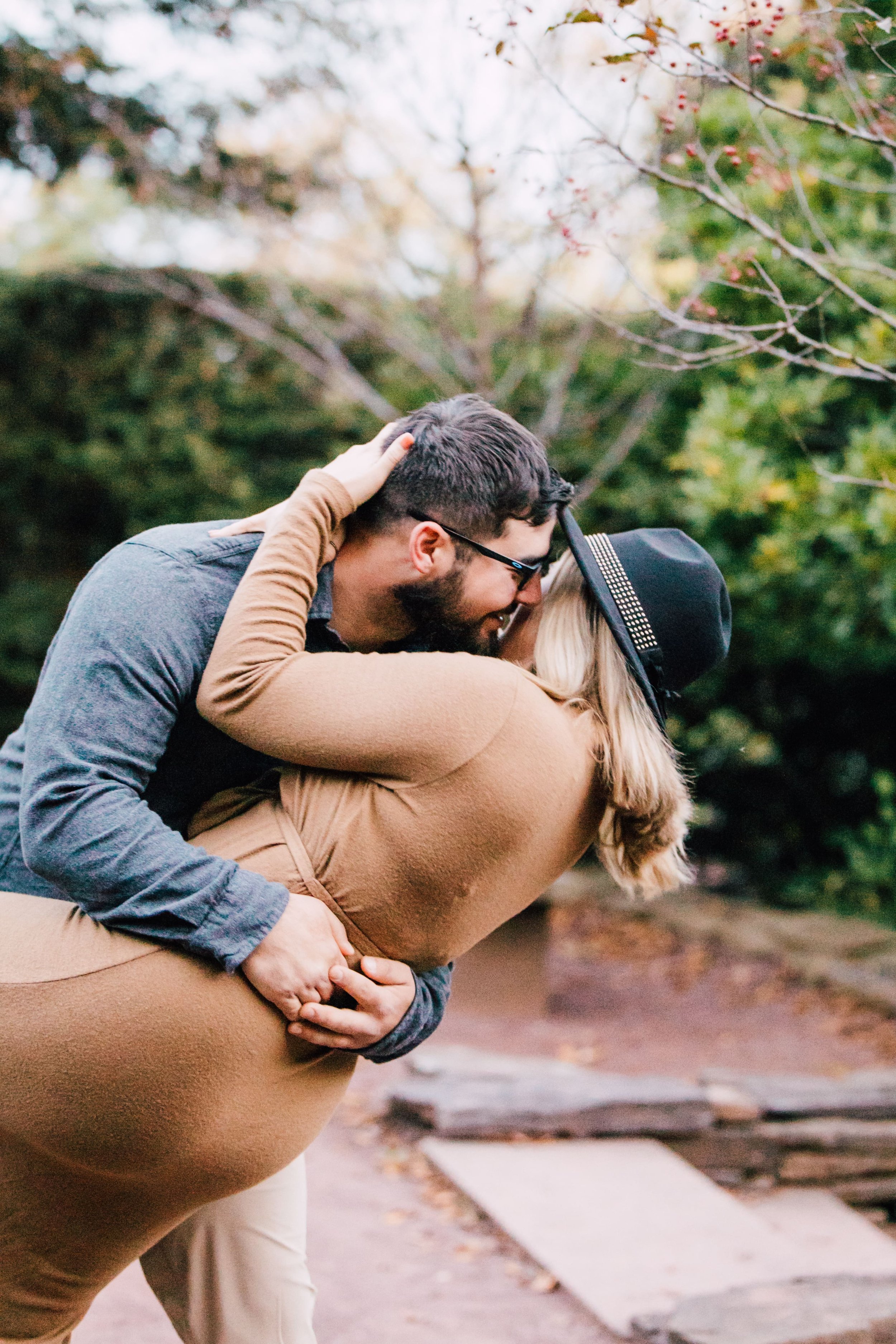  dustin dips marissa during their proposal photography session 