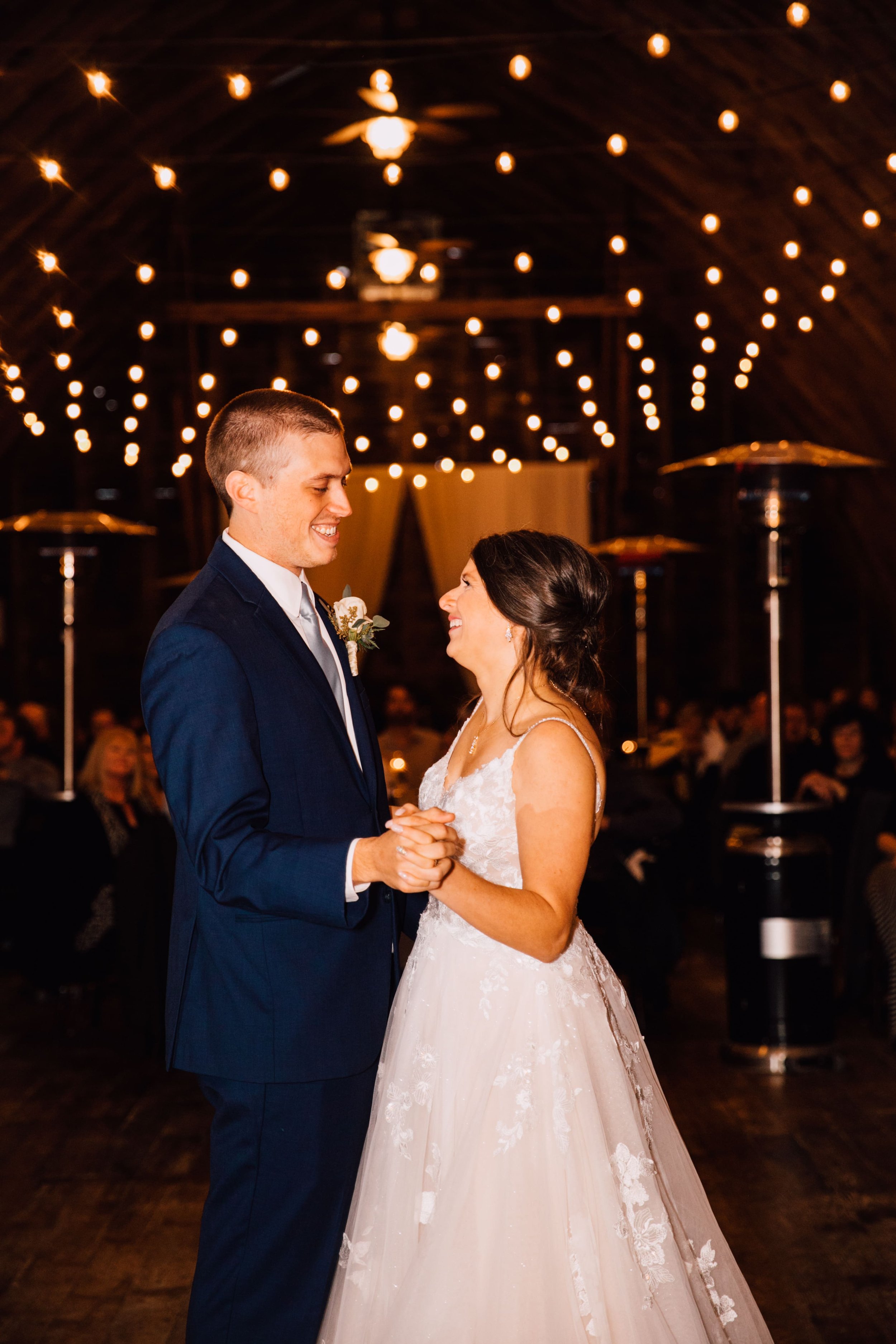  the bride and groom share their first dance at their rustic fall wedding reception 