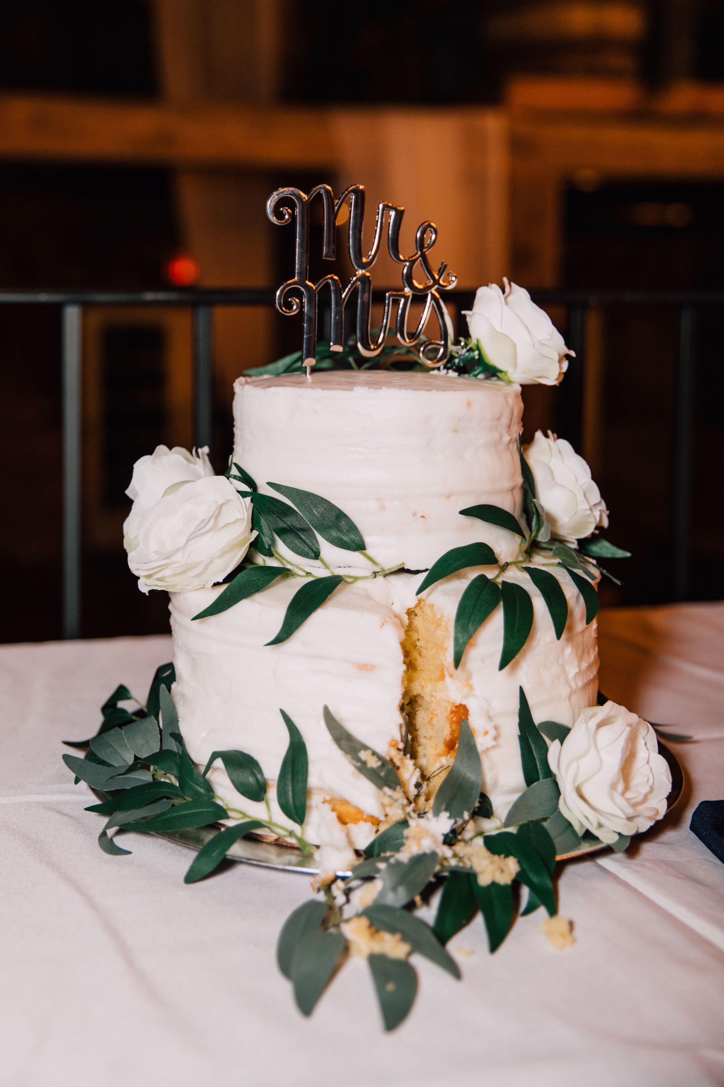  a rustic wedding cake after the bride and groom cut it at their elegant barn wedding 