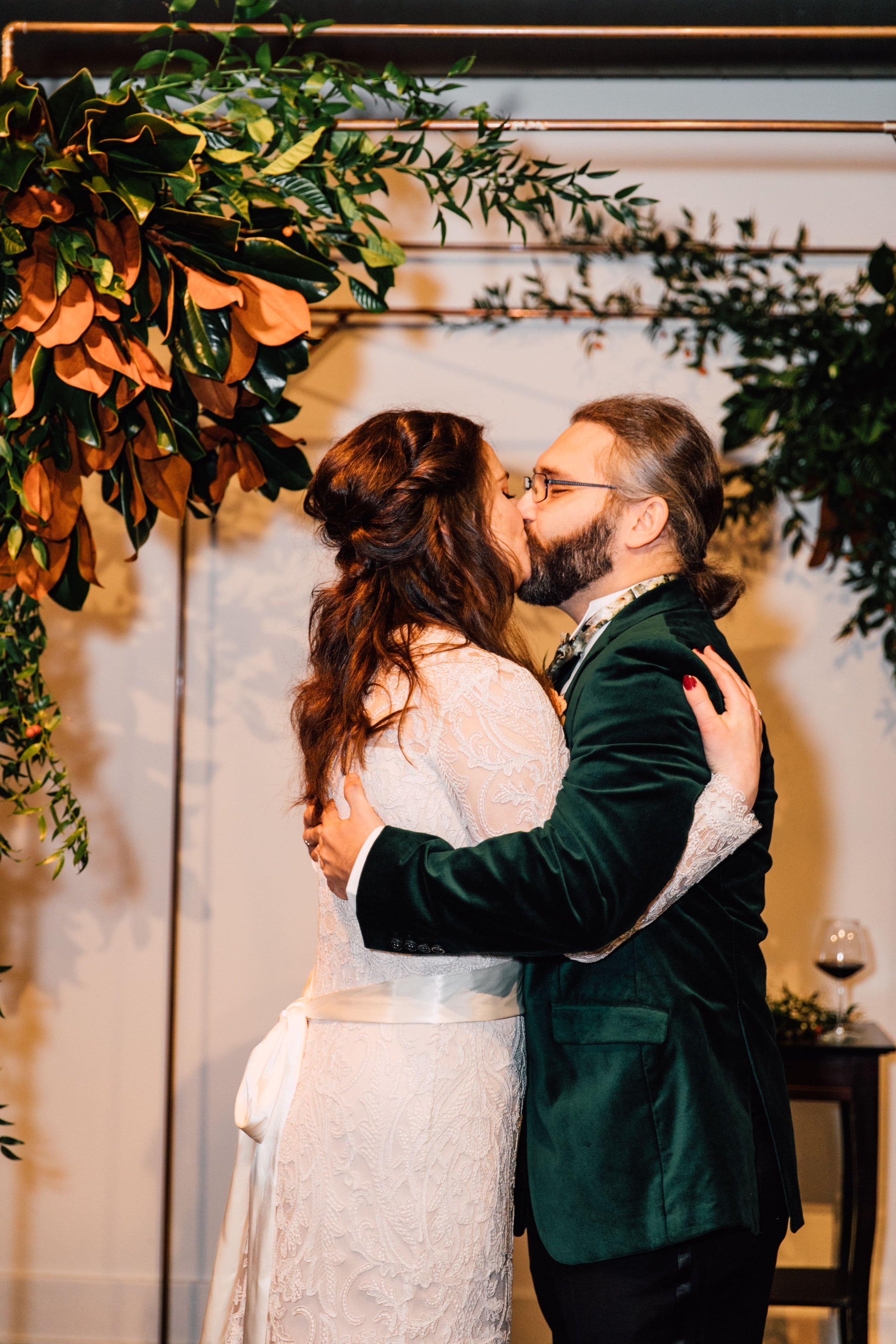  the bride and groom share their first kiss at their  sky armory wedding ceremony while syracuse ny wedding photographer captures it all 