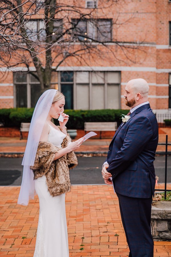  Bride tears up while reading vows during winter elopement on New Years Day in Syracuse NY 