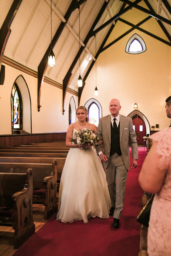  Bride gets emotional during church wedding ceremony processional at Trinity Episcopal Church in downtown Syracuse 