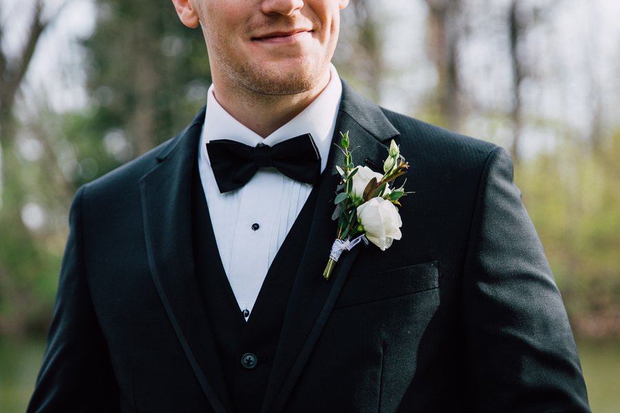  Close up of Groom’s tux, bowtie, and flowers from Spruce Ridge 