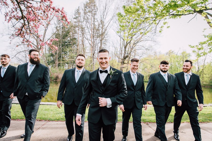  Groom and Groomsmen laughing on wedding day during portraits with Brittany Juravich 
