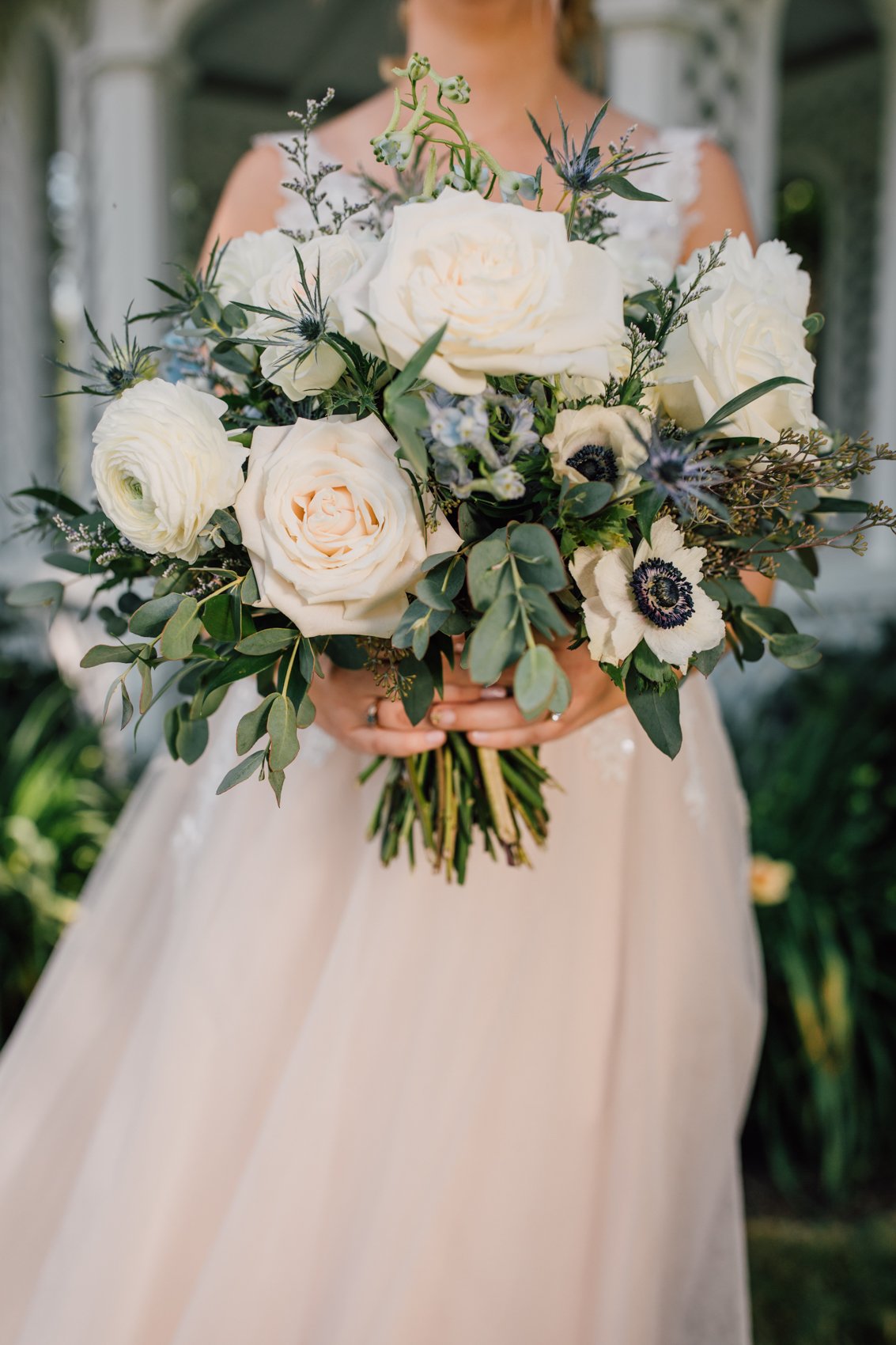  Close up of the bridal bouquet with white roses, garden roses, and lots of greenery 
