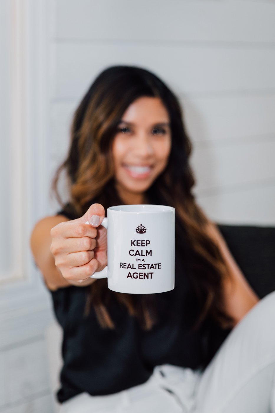  Kawela Home Team realtor holding a mug that says "Keep Calm I'm a Real Estate Agent" 