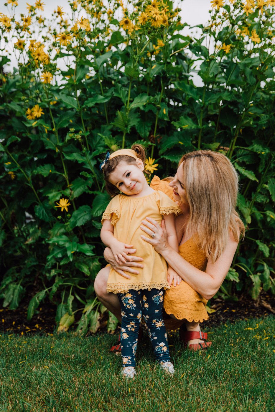 Mother and daughter smile during photos taken by family photographer Brittany Juravich 