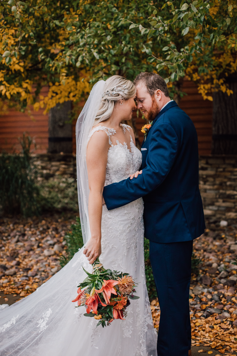  Bride and Groom embrace during fall wedding photos in central ny 