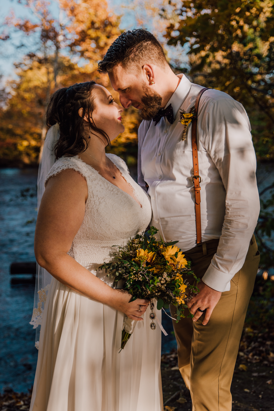  Fall wedding photos taken in front of the river at Tailwater Lodge in Altmar NY 