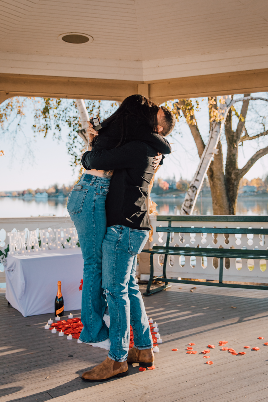  Newly engaged couple hugs after surprise proposal in Skaneateles NY 