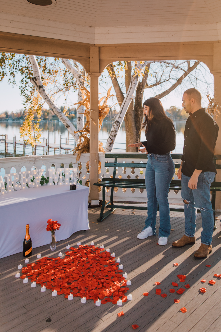 Woman admires the proposal setup by her fiance on Skaneateles Lake 