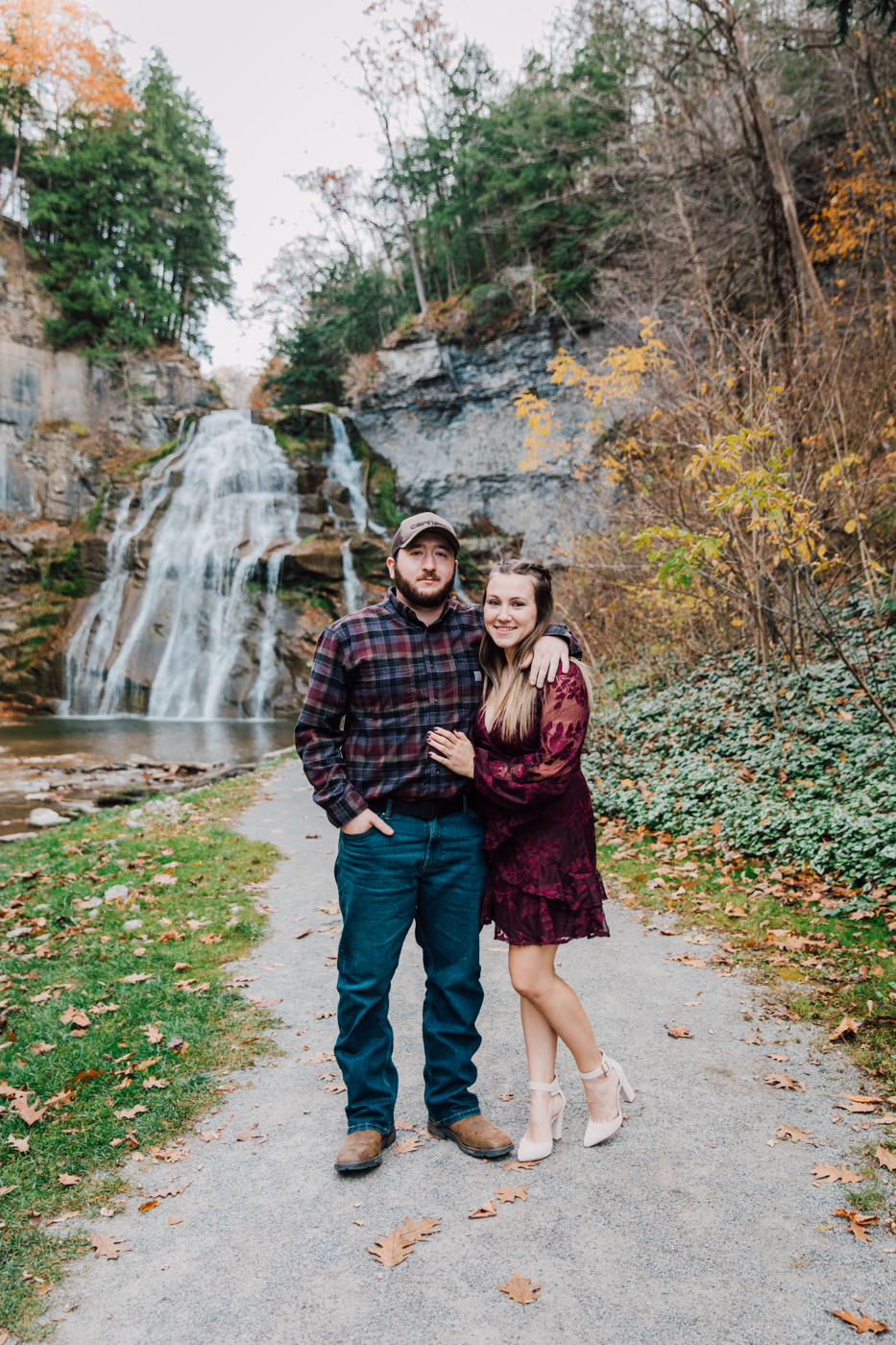  Engaged couple poses in front of a waterfall in Cazenovia NY 