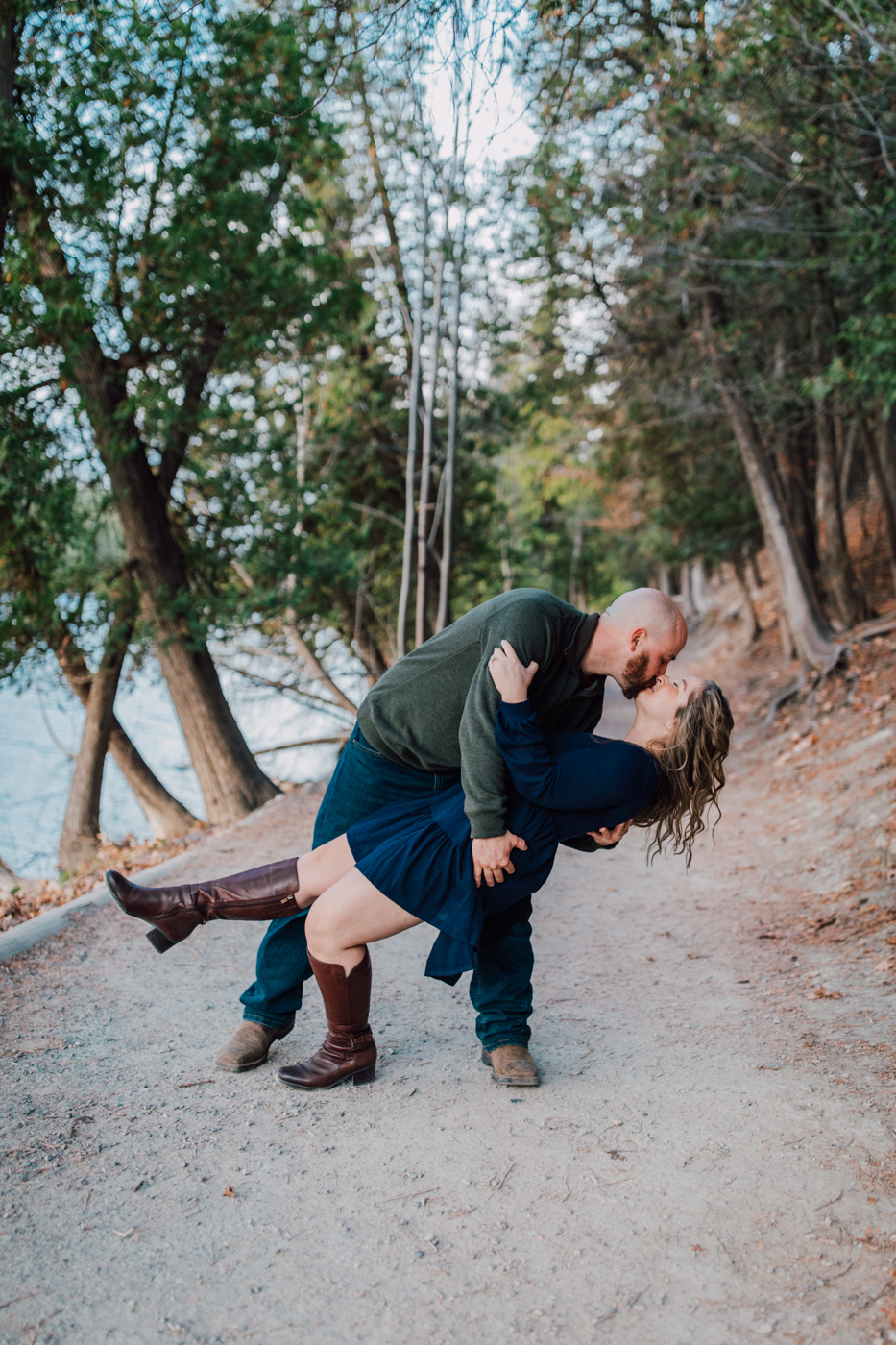  Man dips his fiance in the woods during their fall engagement photos with Brittany Juravich 