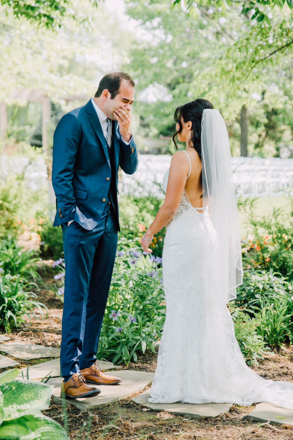  Groom looks shocked when he sees his Bride for the first time during their wedding first look at Lodge at Turning Stone 