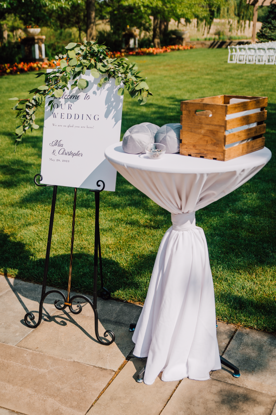  Table with kippahs at the entrance to a Jewish outdoor wedding ceremony at Lodge at Turning Stone 