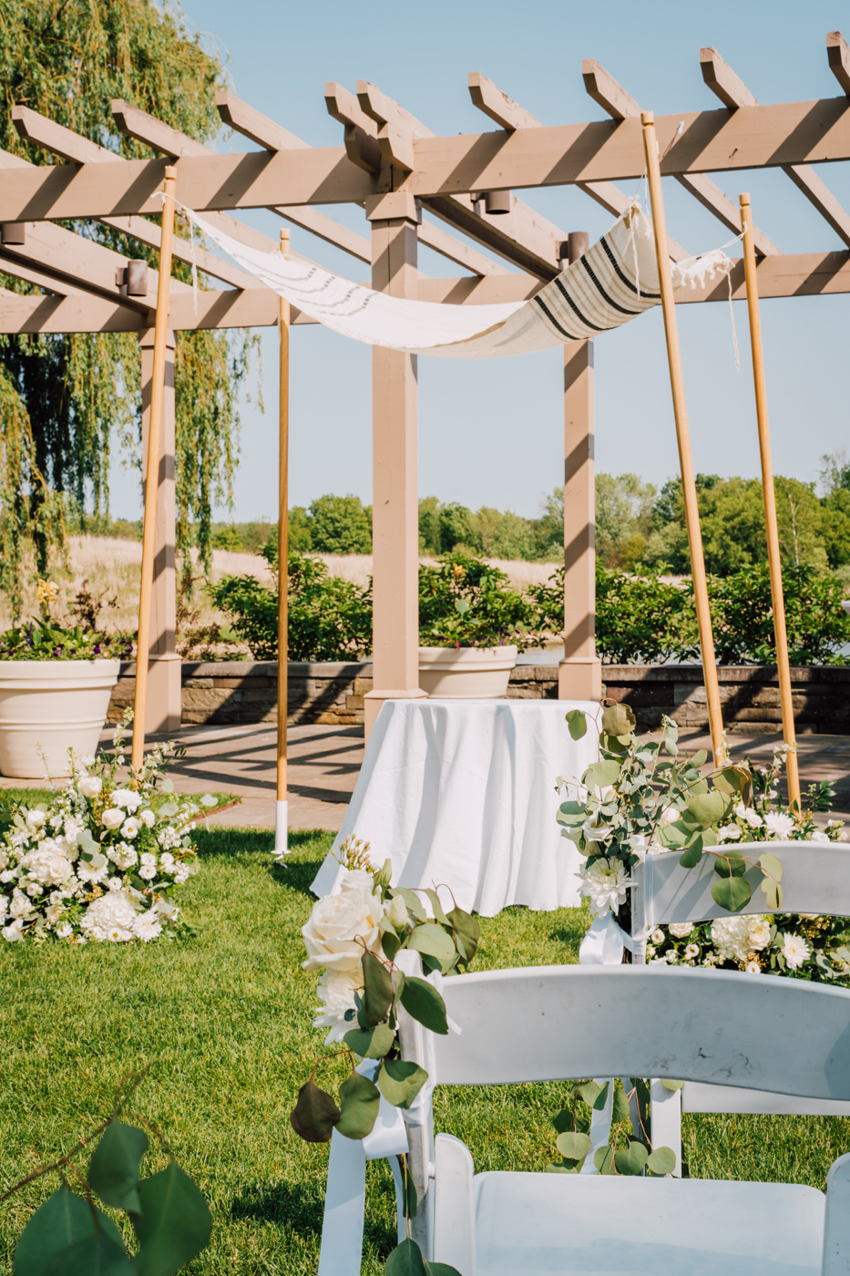  Wooden and cloth chuppah at an outdoor wedding ceremony in Central NY 