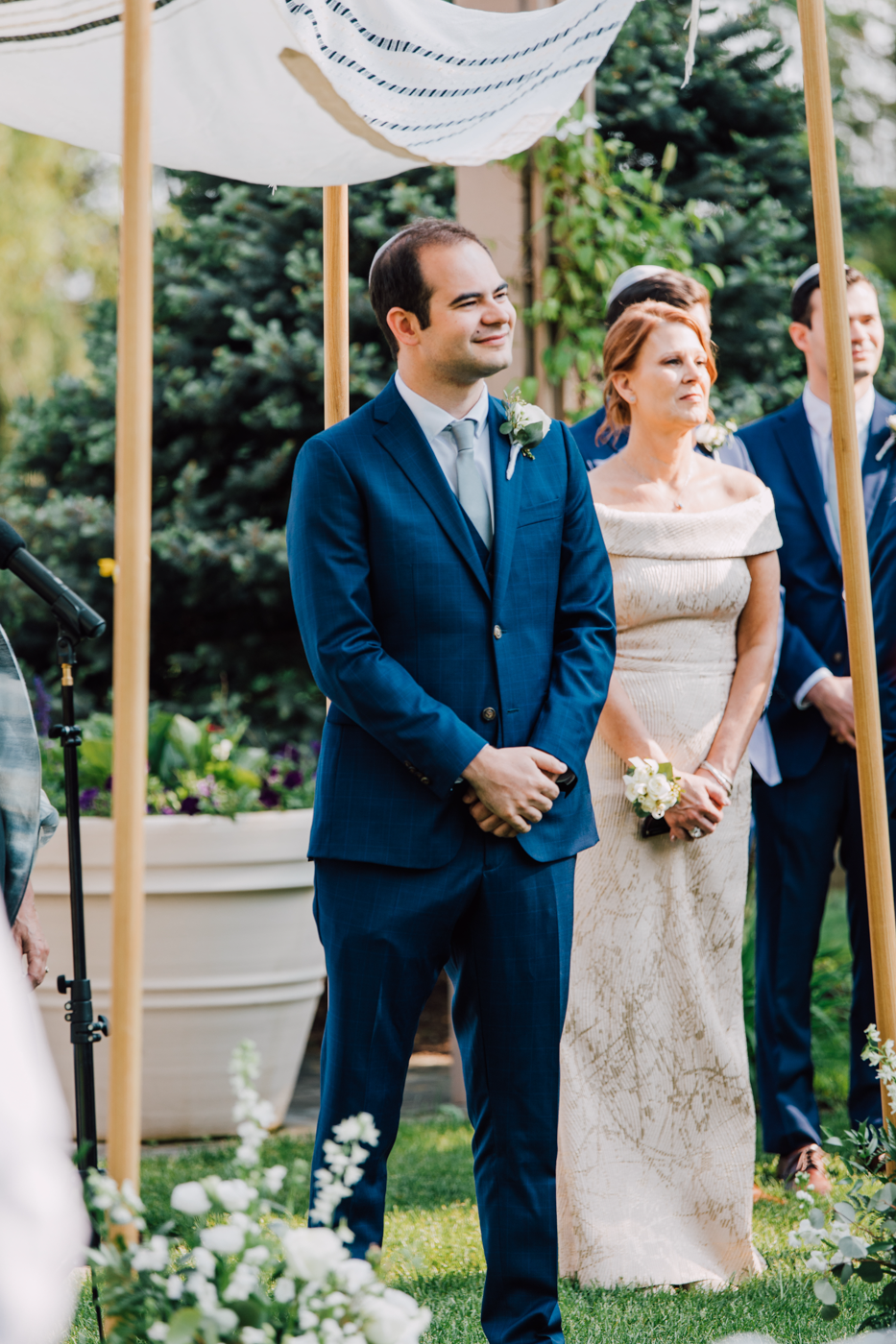  Groom smiles as his Bride walks down the aisle at their Jewish wedding in Central NY 