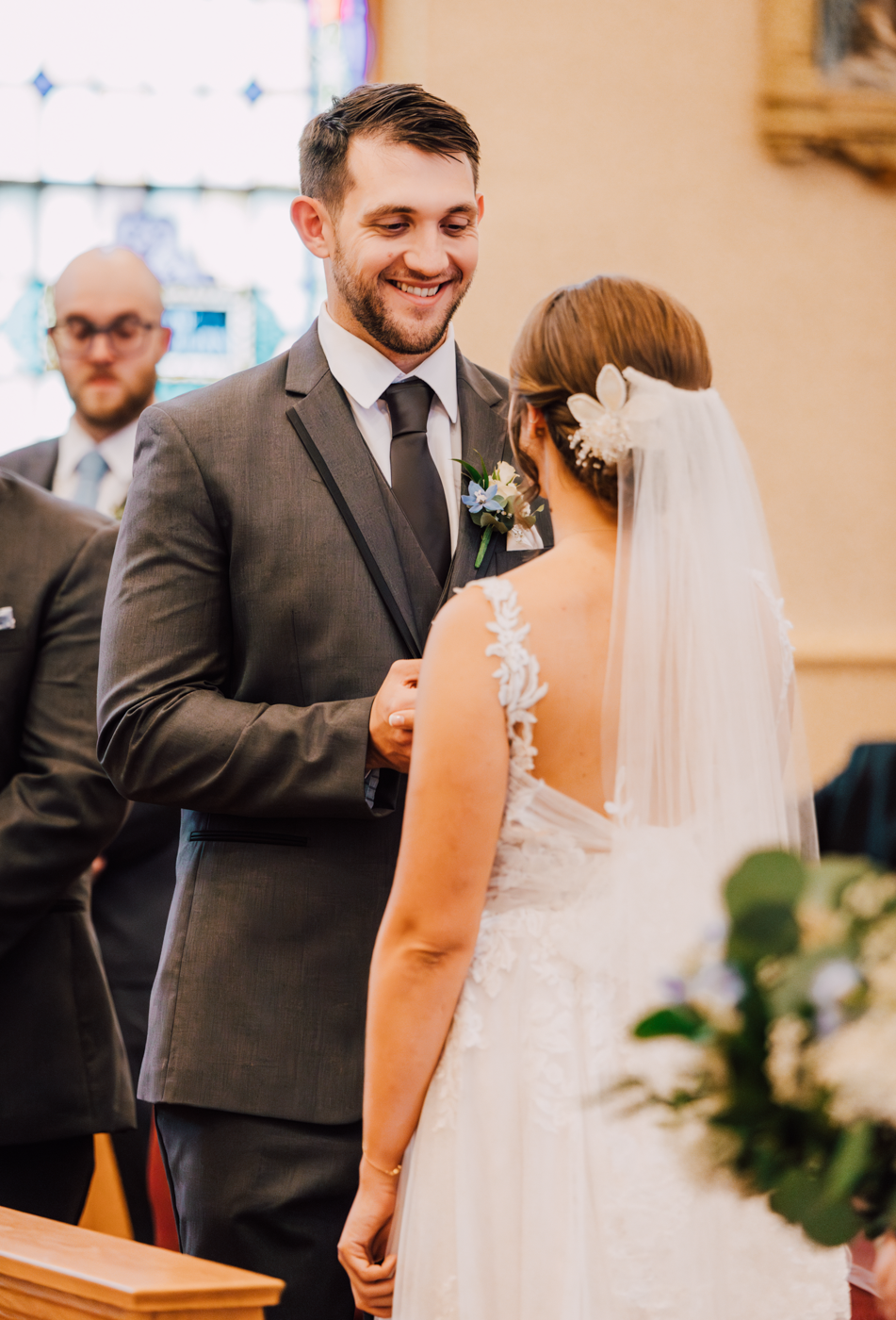  Groom smiles during the traditional wedding ceremony in Marcellus NY 