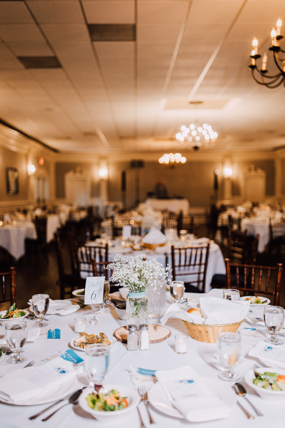  Simple charming wedding reception decor at the Springside Inn in Auburn NY with ball jars of baby’s breath as centerpieces 