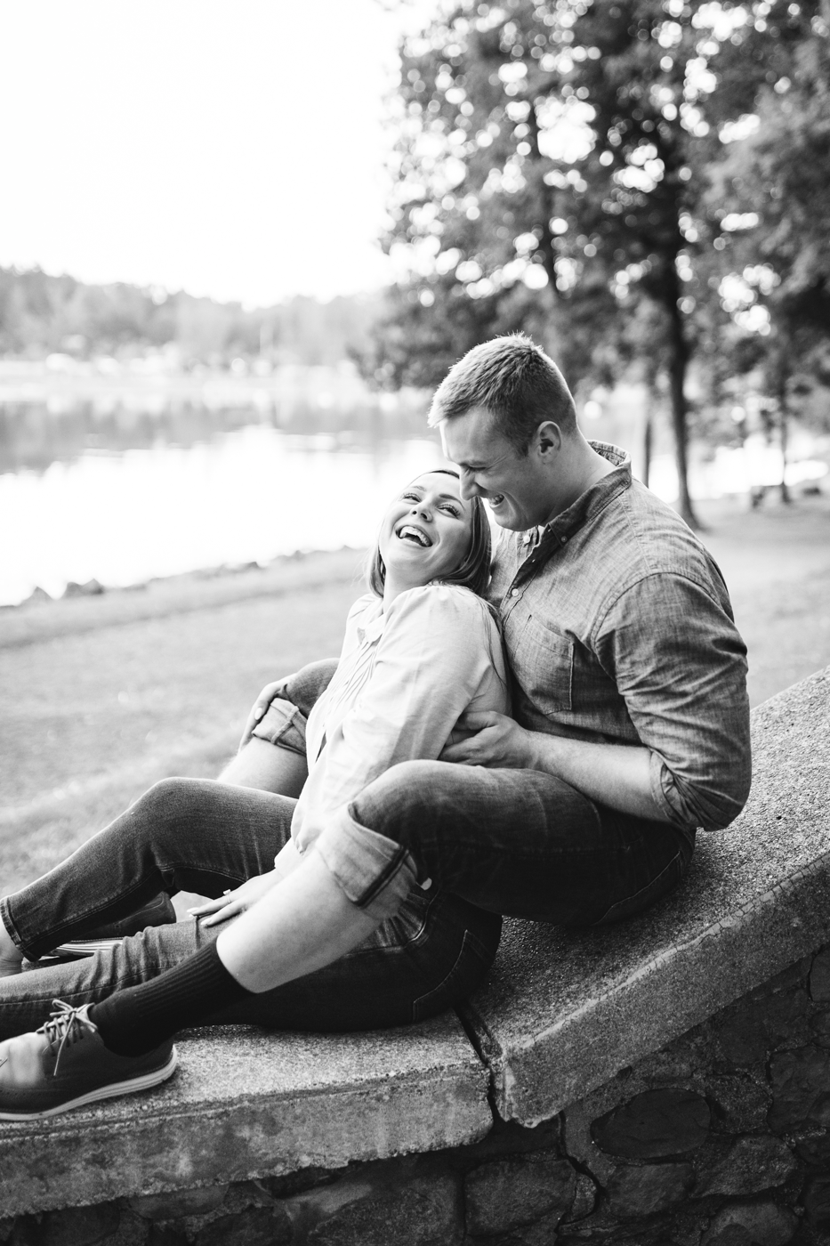  Engaged couple laugh together during an awkward photoshoot at Green Lakes State Park with Brittany Juravich 