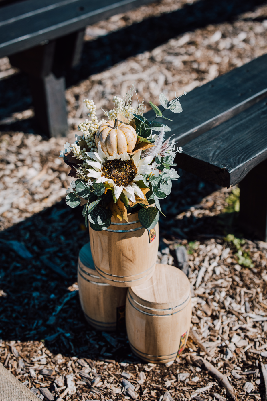  Outdoor fall wedding ceremony decor with wooden barrels and pumpkins 