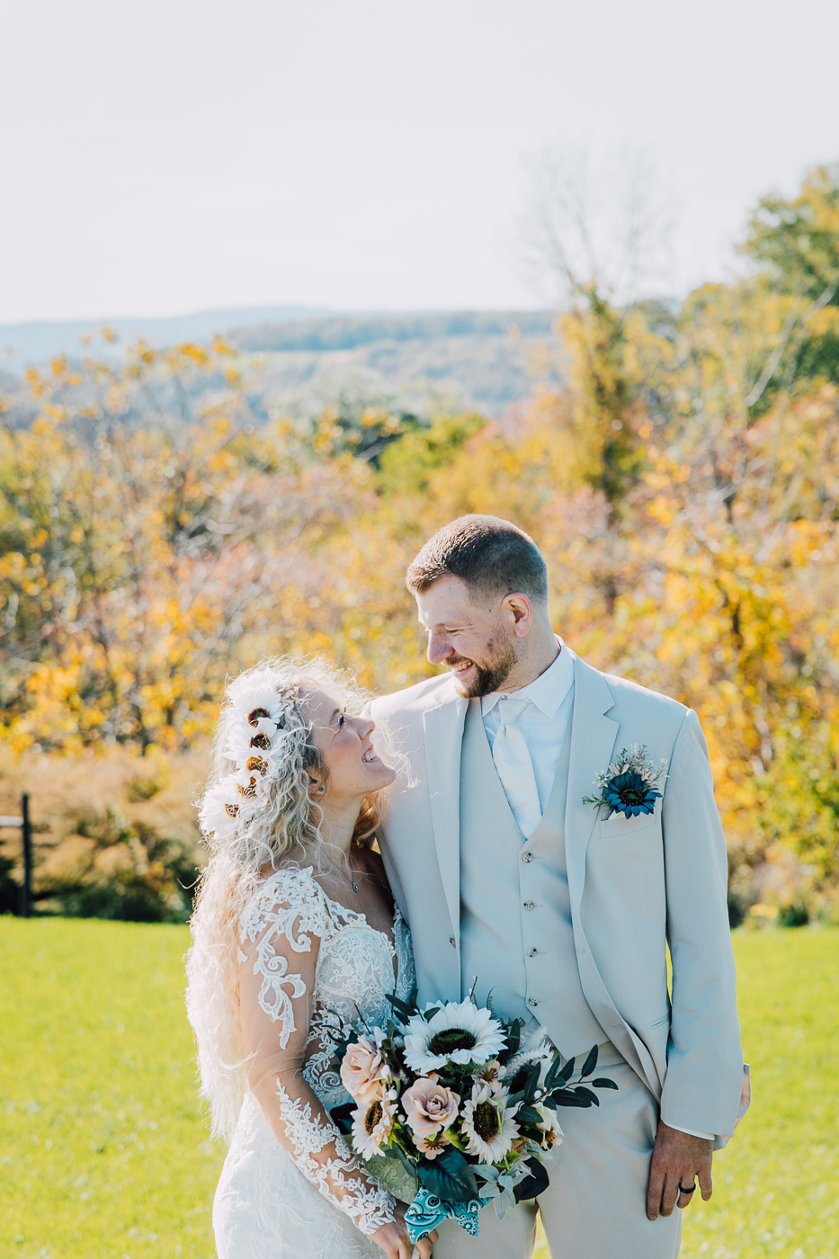  Bride and Groom embrace during fall wedding photos at Paradise Gardens in Central NY 