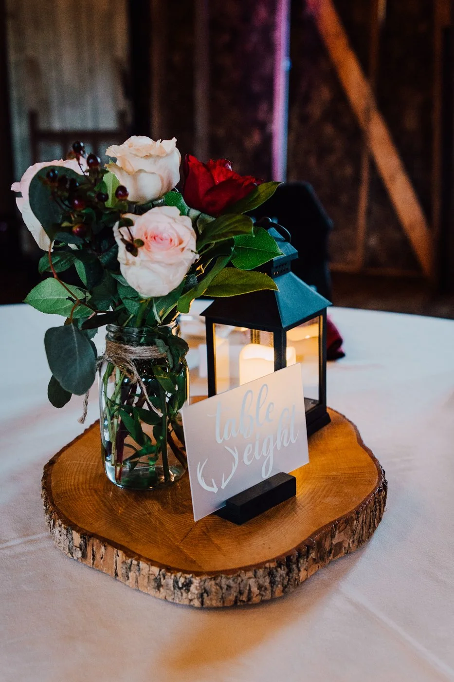  Barn wedding decor with rustic floral centerpieces and lanterns 