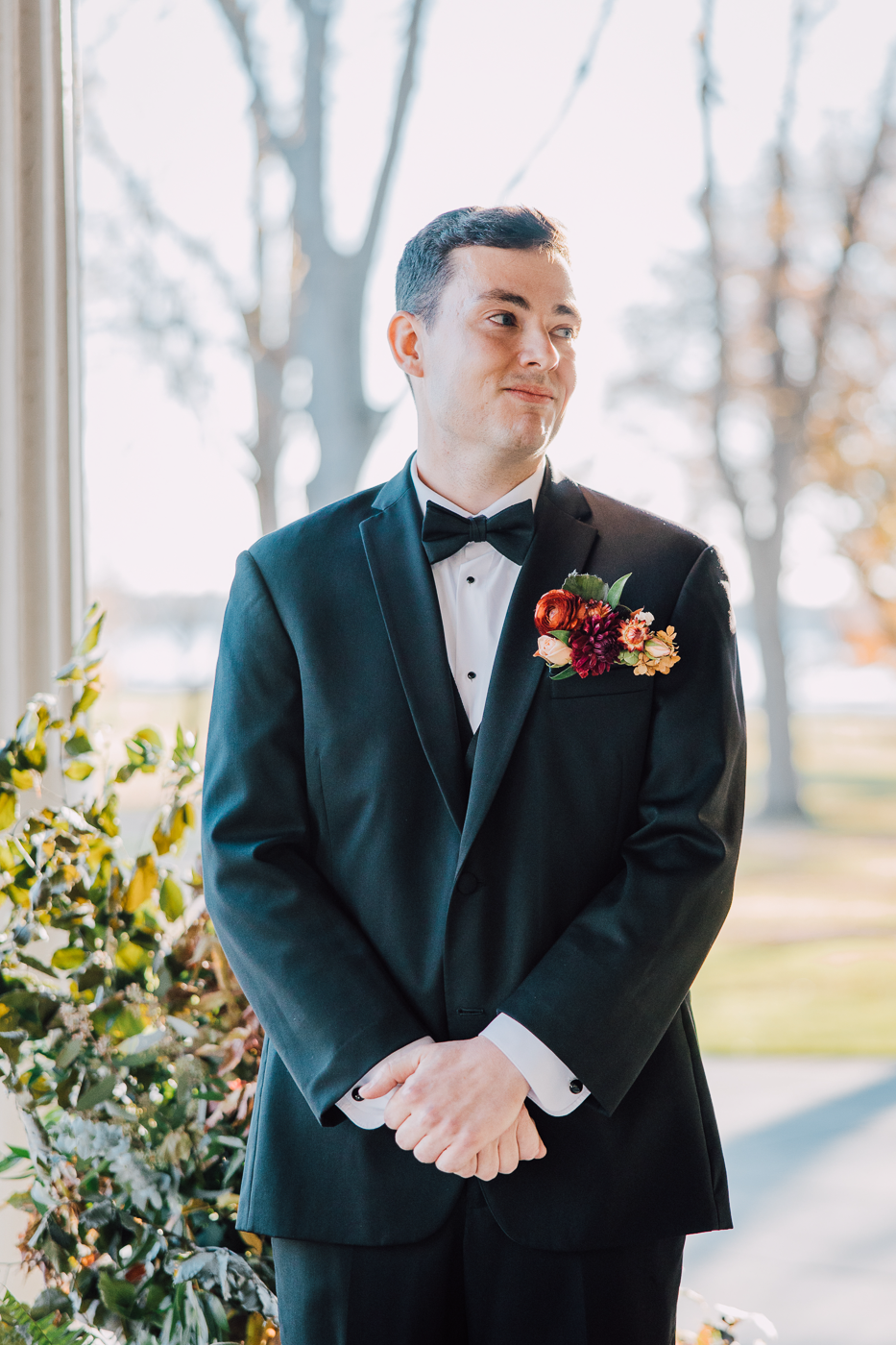  Groom watches Bride walk down the aisle during outdoor wedding ceremony 