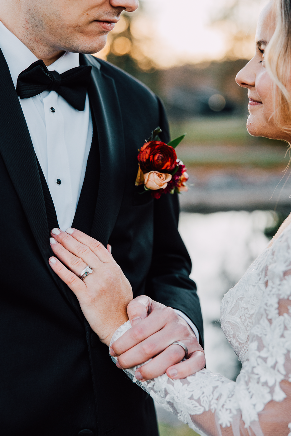  Bride places her hand on her Groom’s chest during wedding photos 