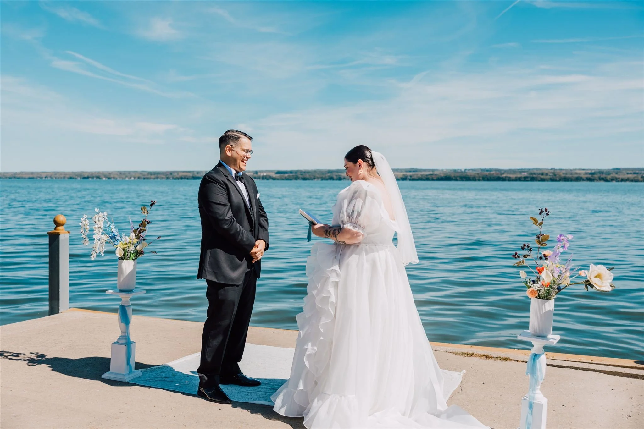Bride and Groom say wedding vows in front of Seneca Lake in the Finger Lakes.