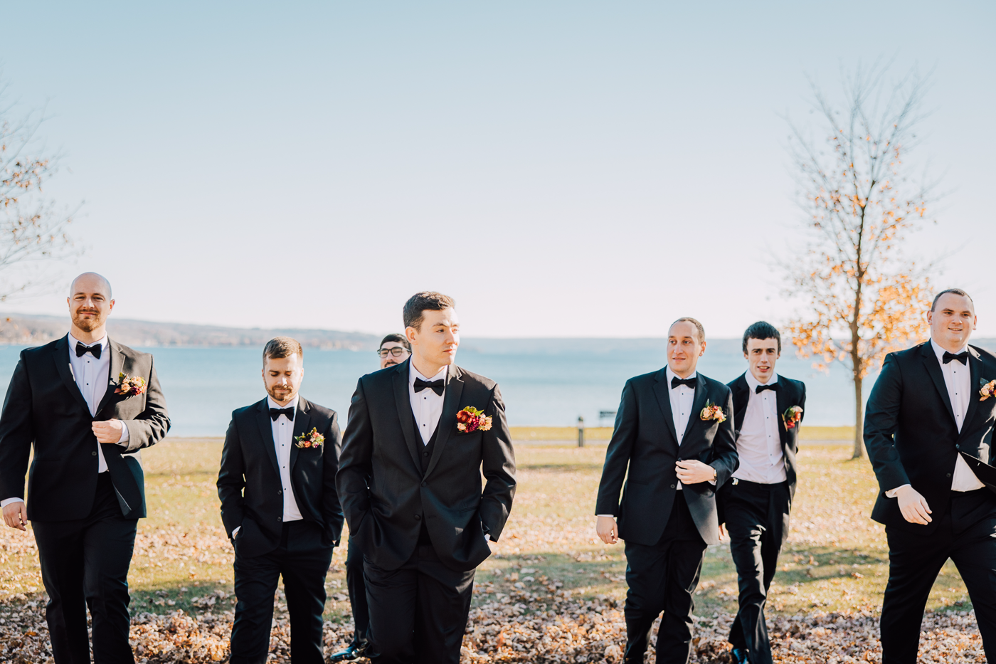 Groom and his groomsmen take lakefront photos before his fingerlakes wedding at Emerson Park Pavilion