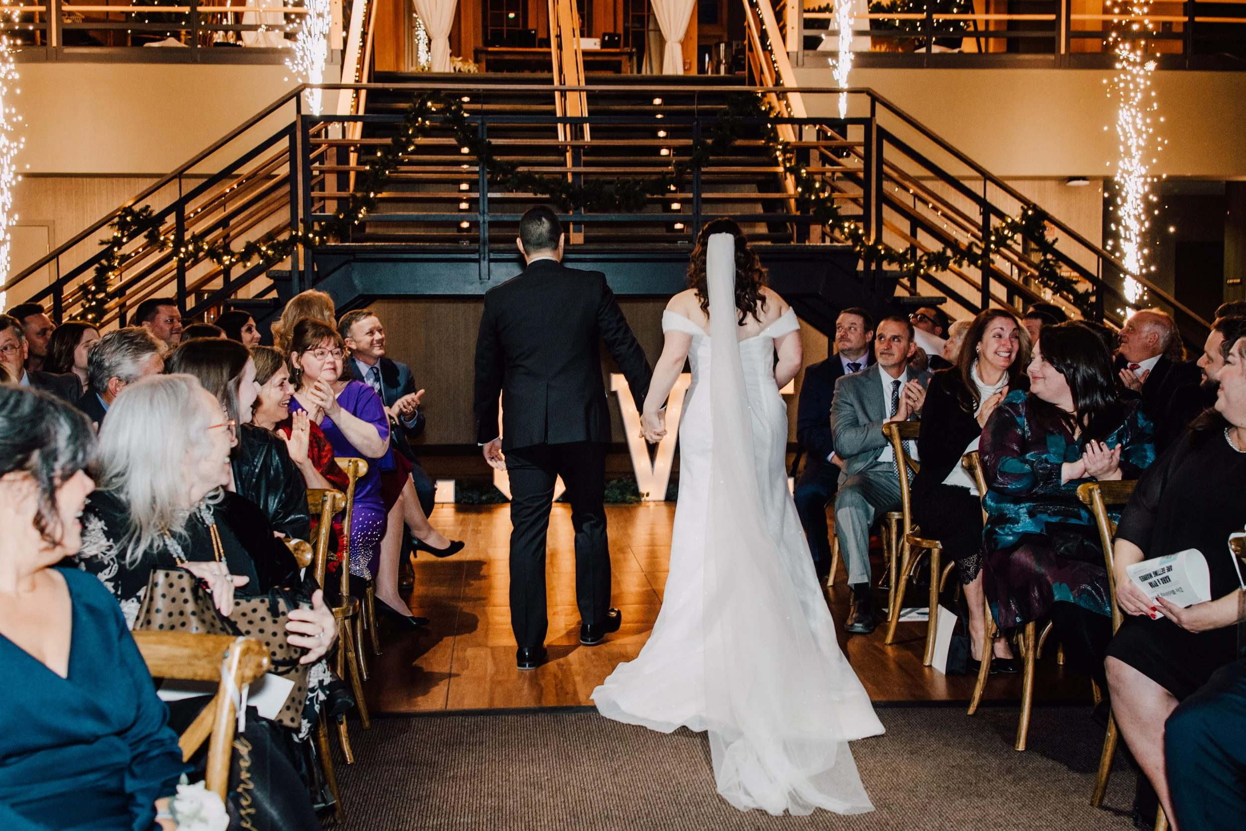 Bride and Groom walking down the aisle at The Lodge Winter Wedding Ceremony