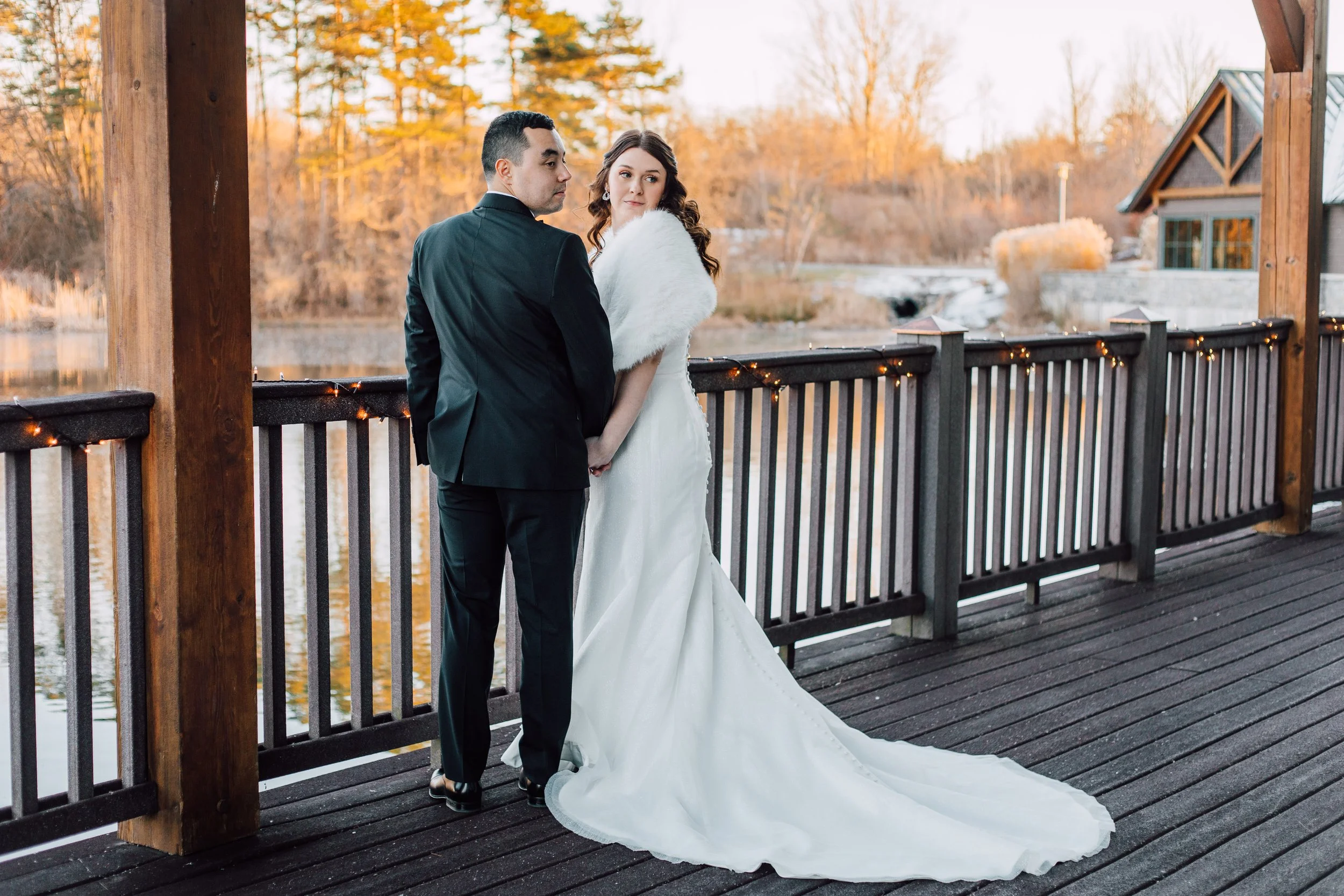 Groom and bride looking back at The Lodge