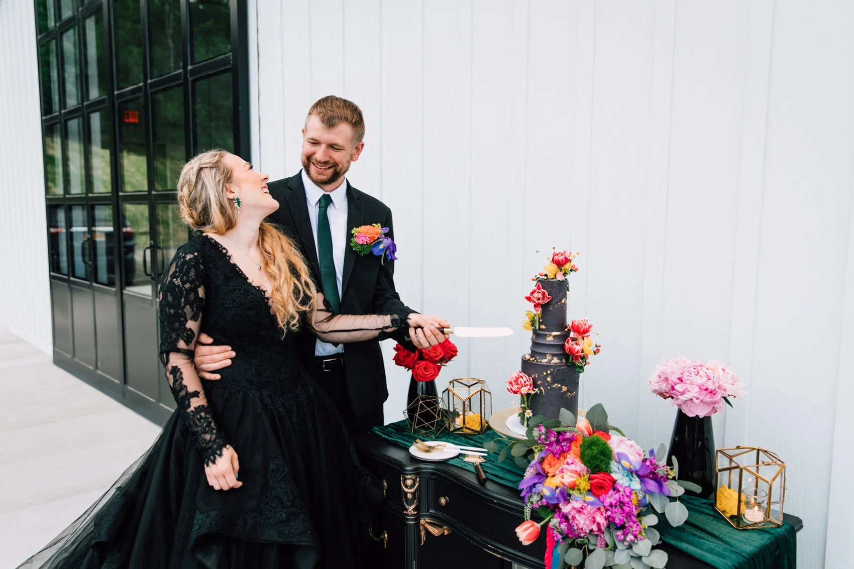 Couple cake cutting at wedding