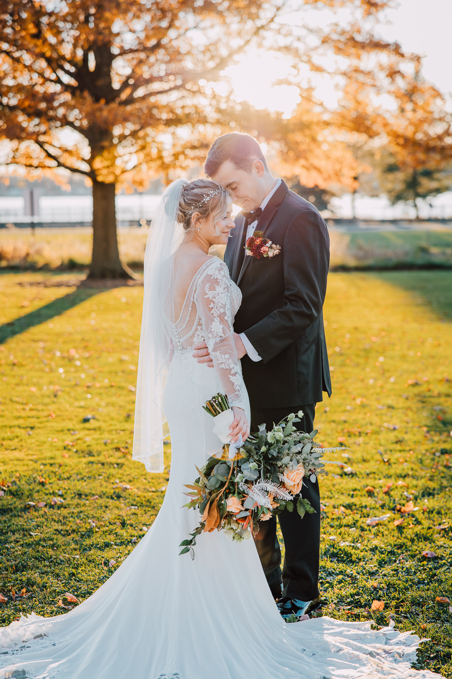 Bride and Groom pose for sunset wedding photos in November at Emerson Park Pavilion